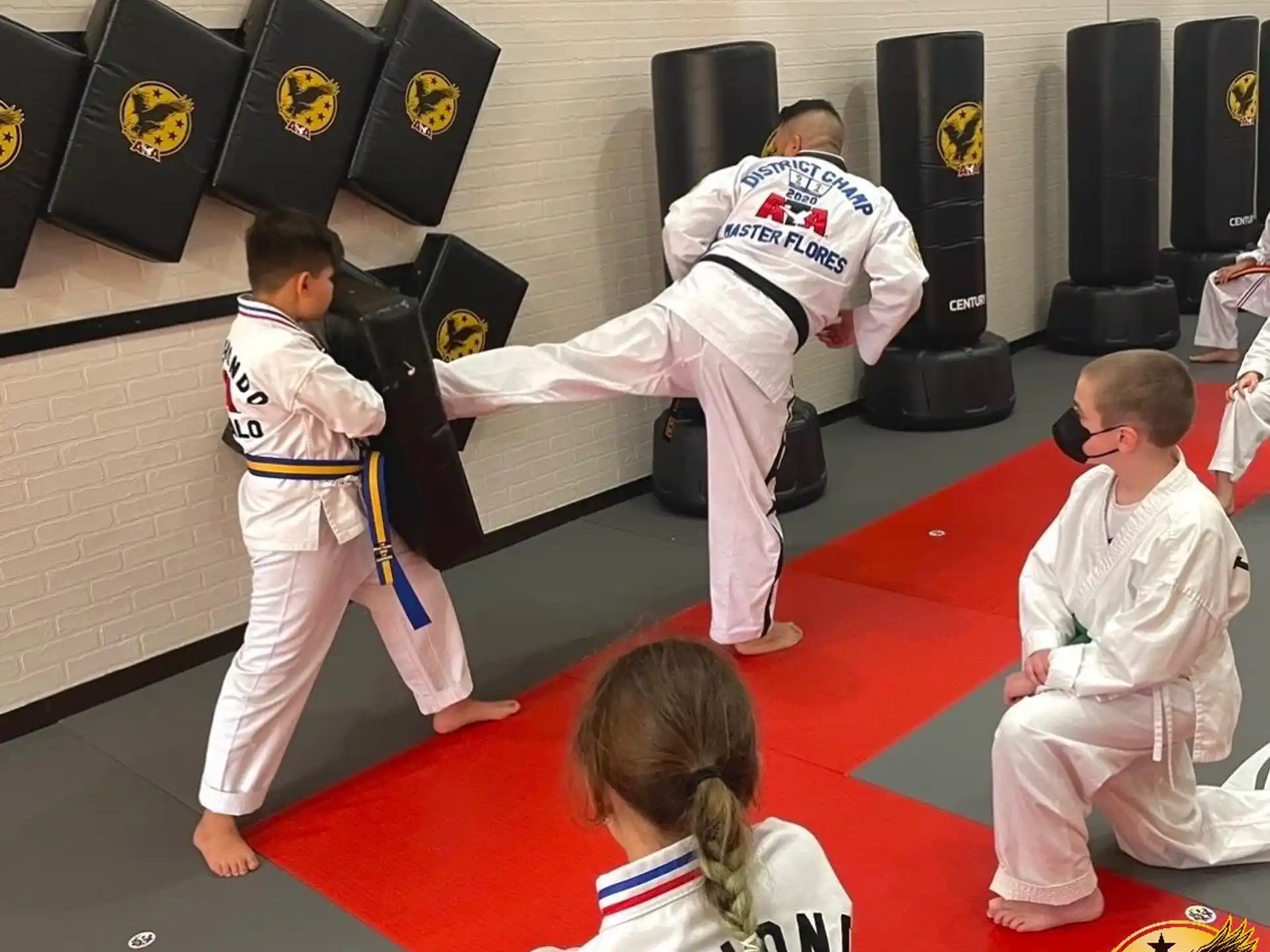 a group of people in karate uniforms