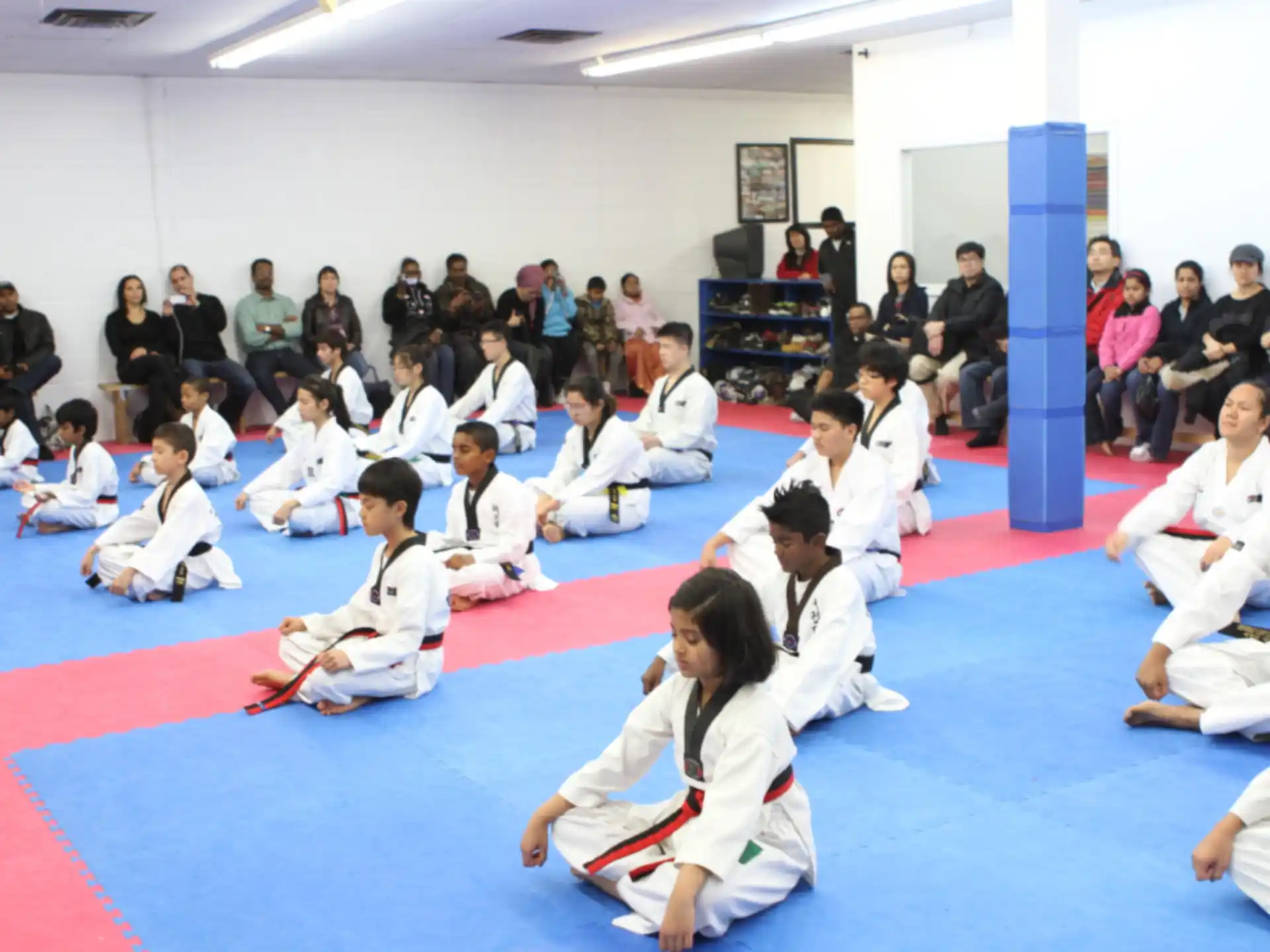 a group of people in karate uniforms