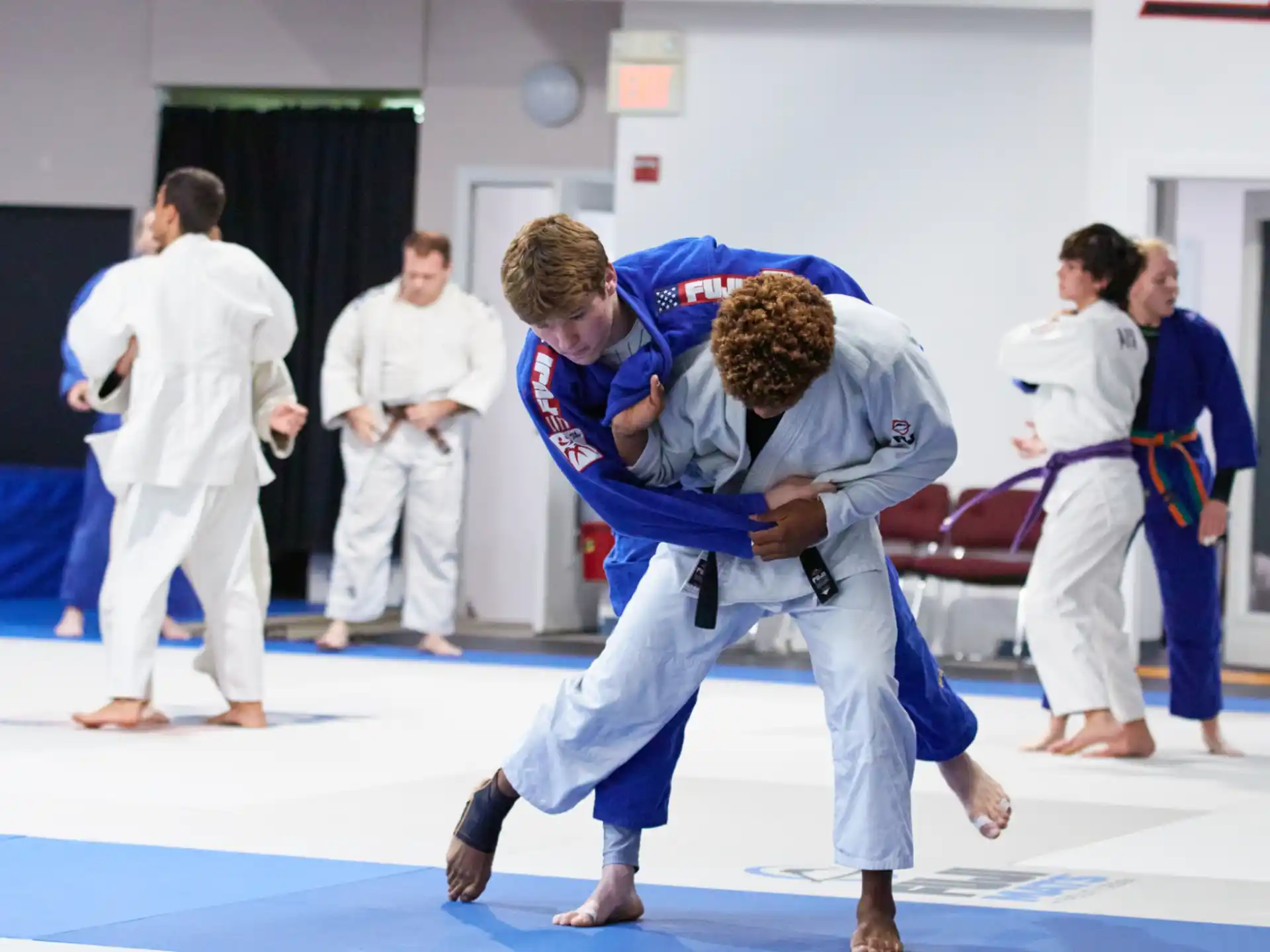 a group of people in karate uniforms