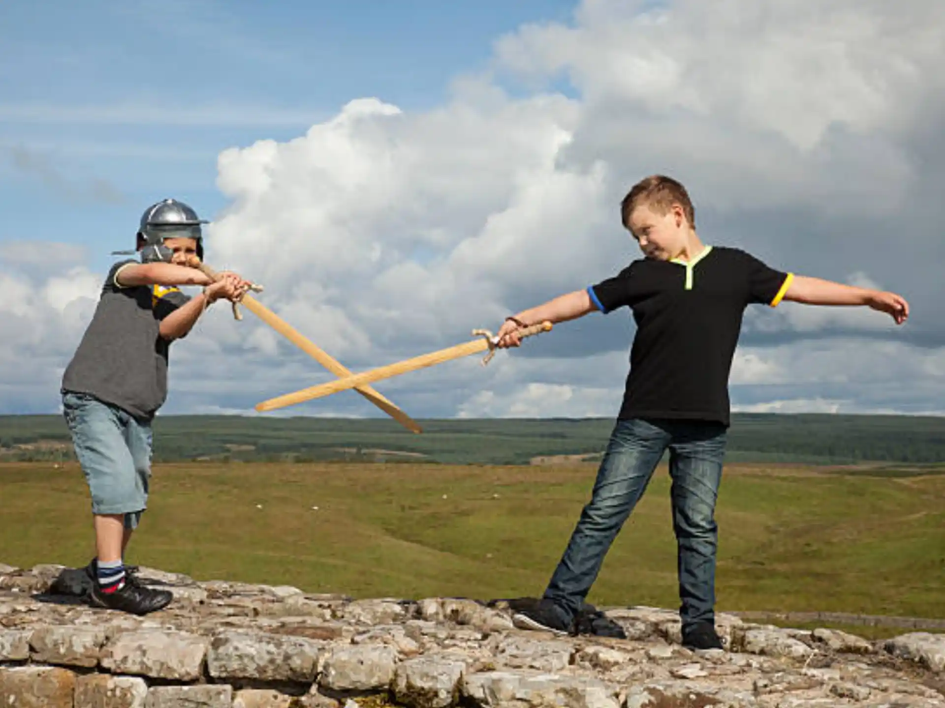 two men holding a bow and arrow
