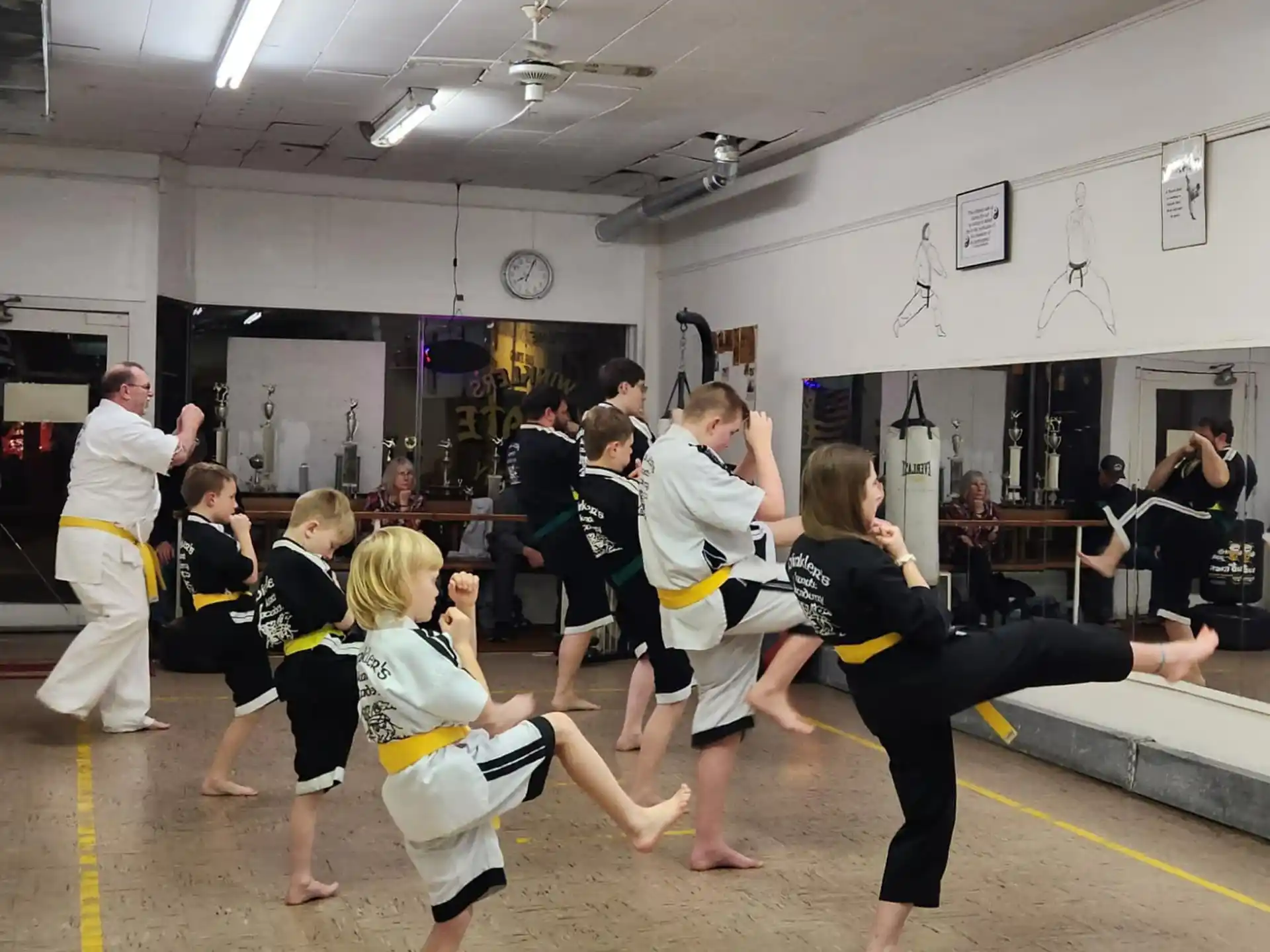 a group of people dancing in a gym