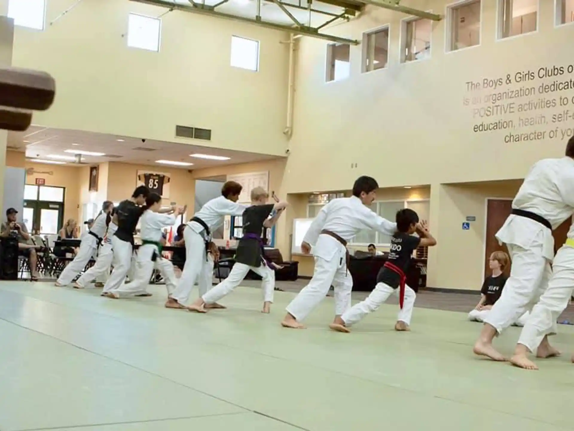 a group of people in karate uniforms