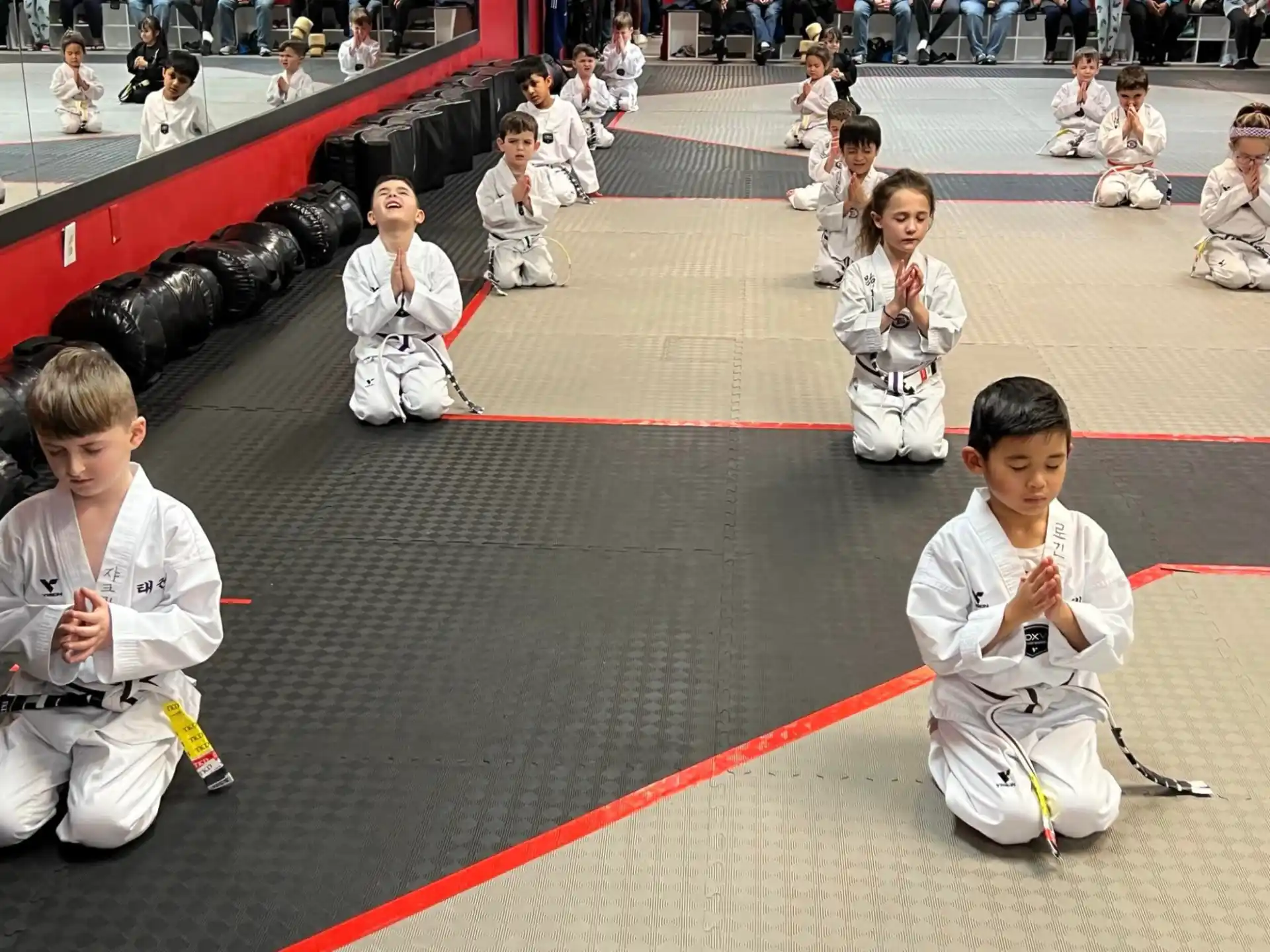 a group of kids in karate uniforms