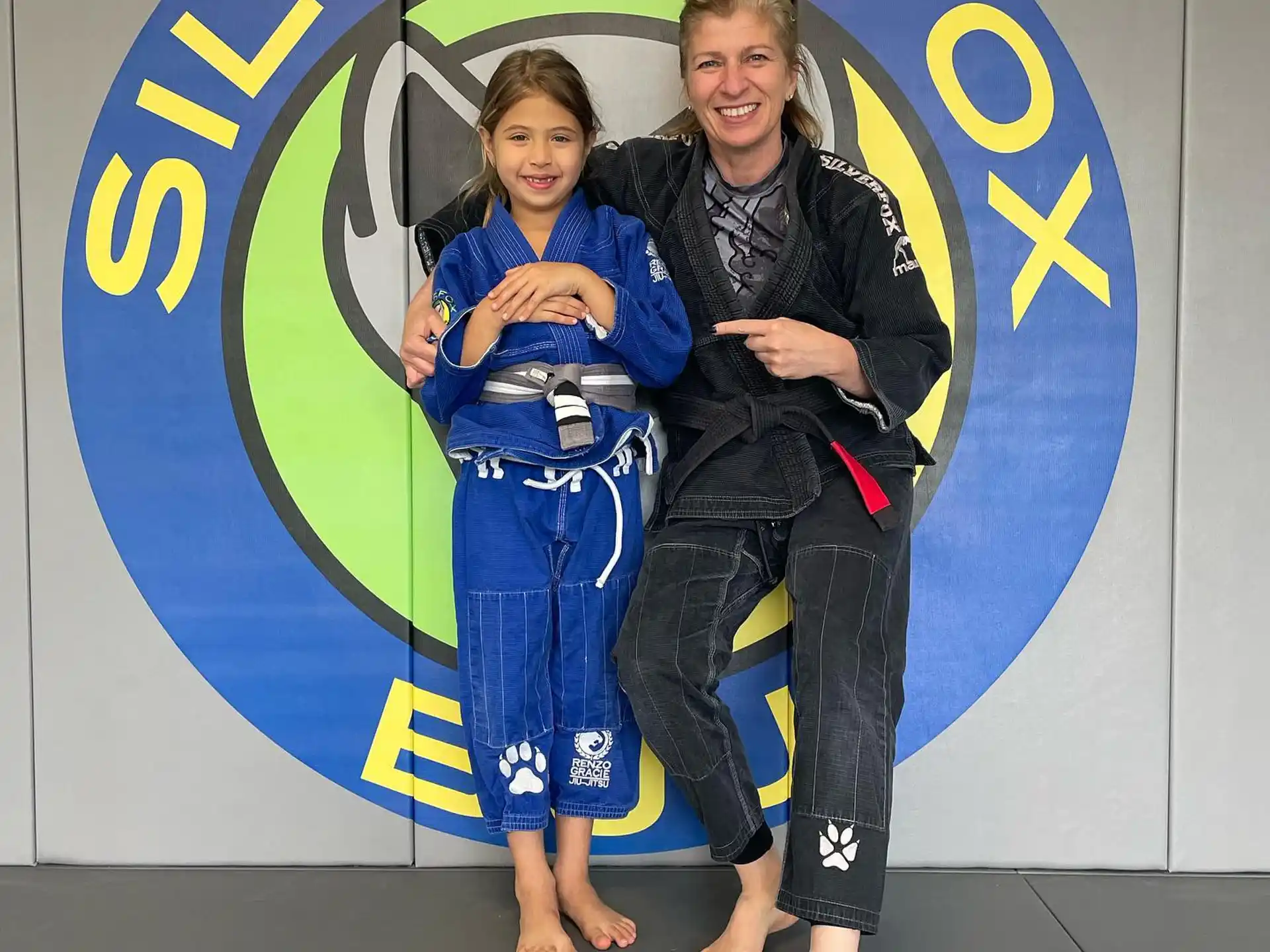 a man and a woman in a martial arts pose