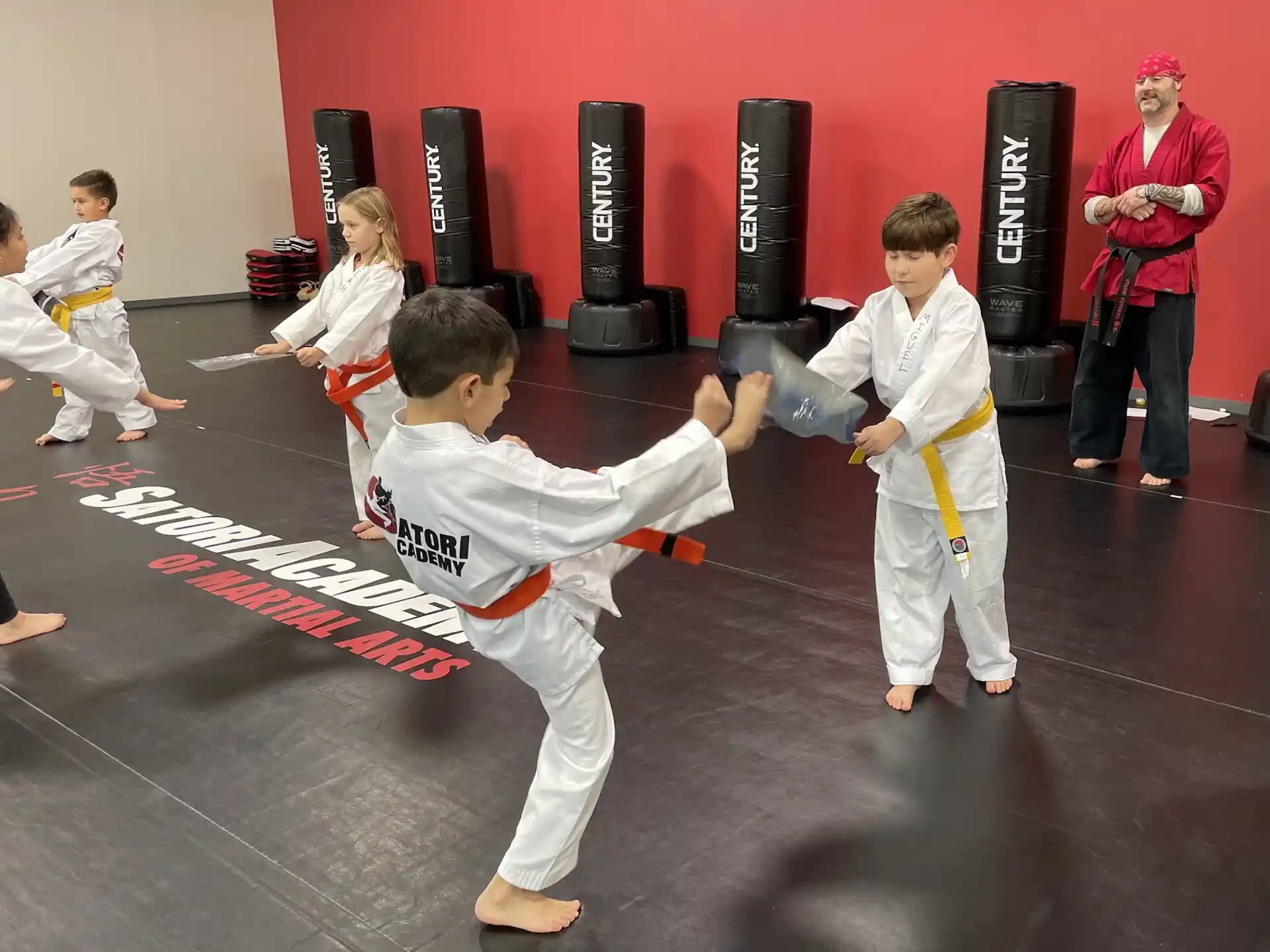 a group of people in karate uniforms