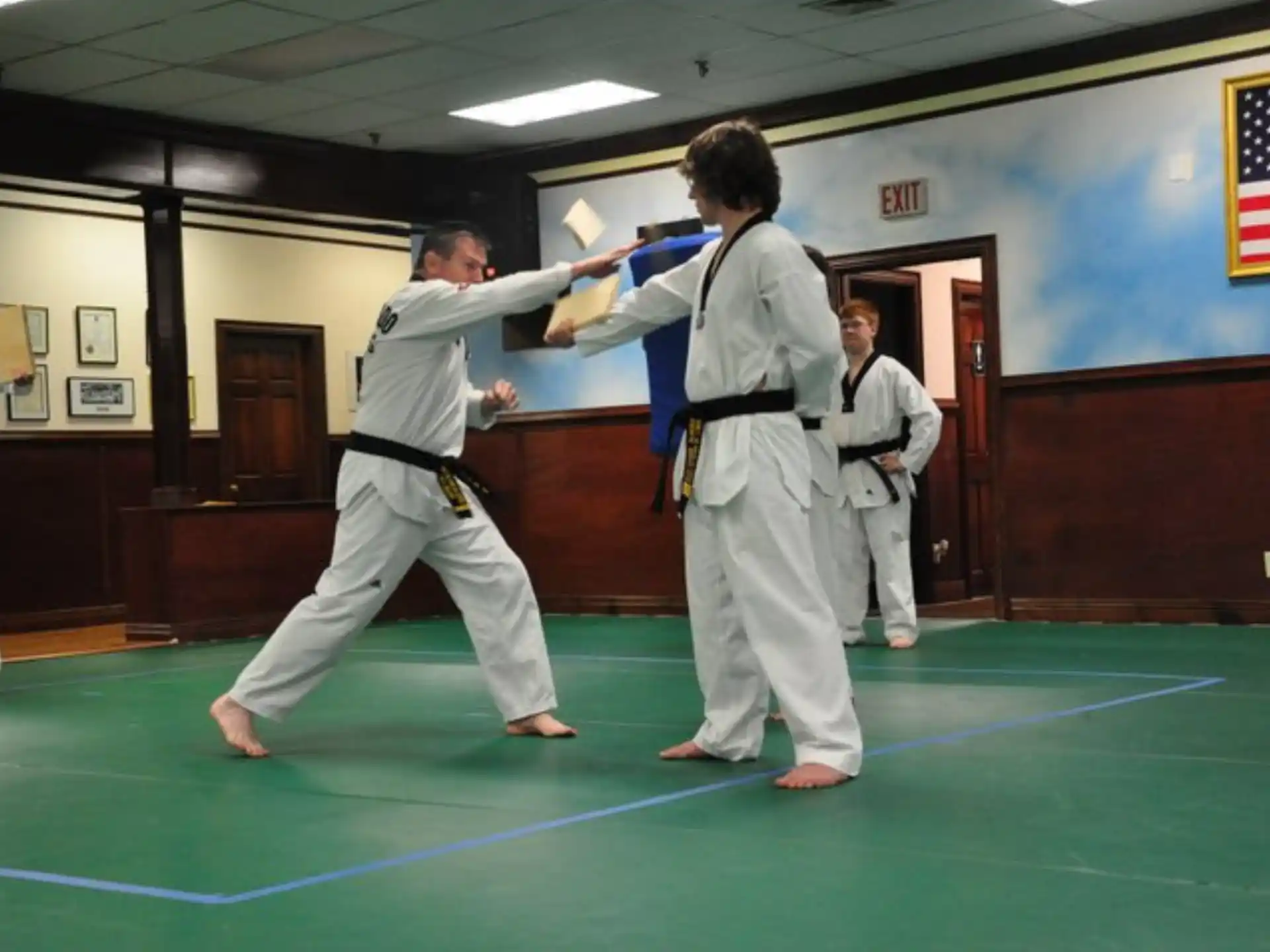 a group of people in karate uniforms
