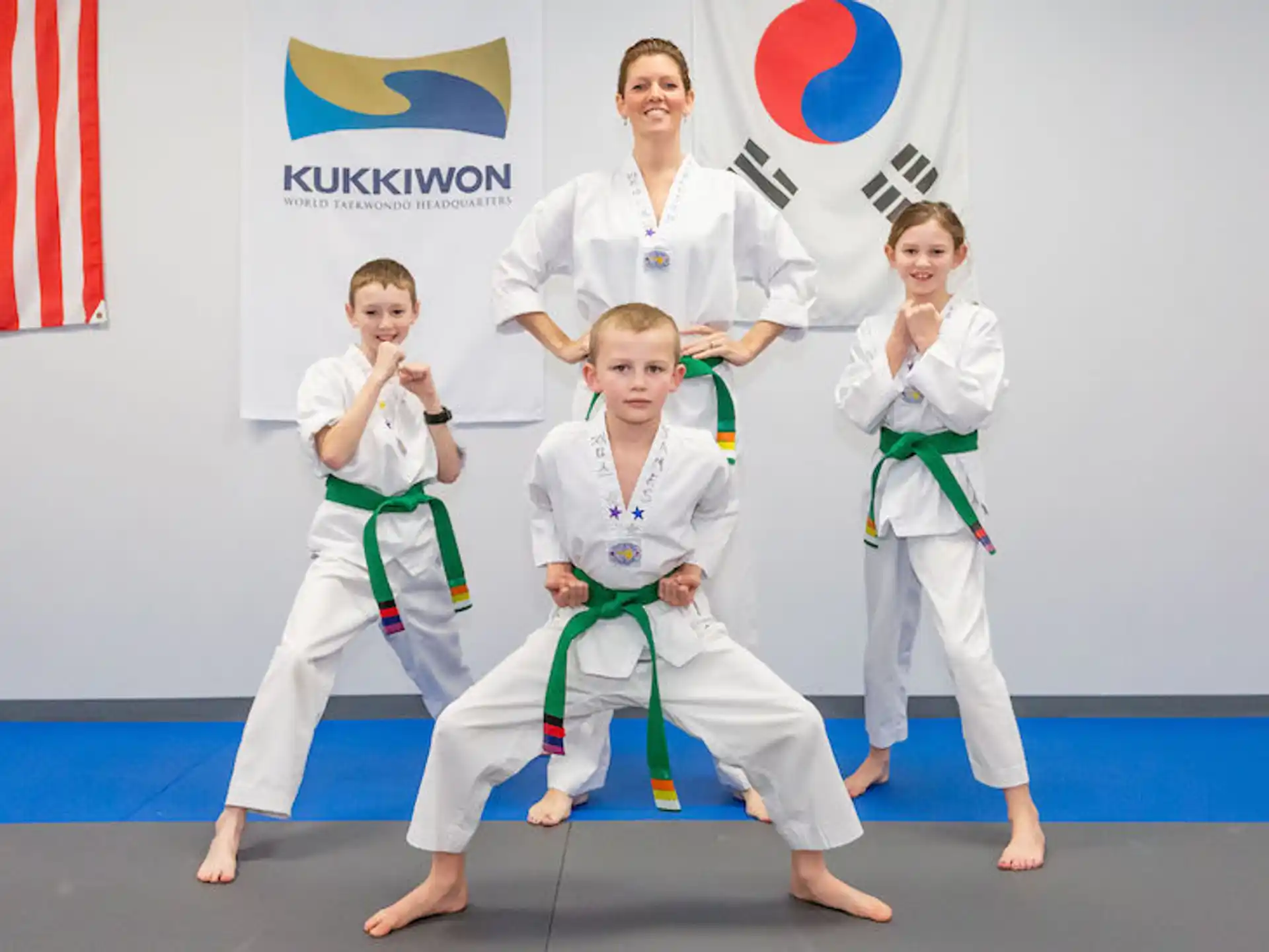 a group of people in karate uniforms