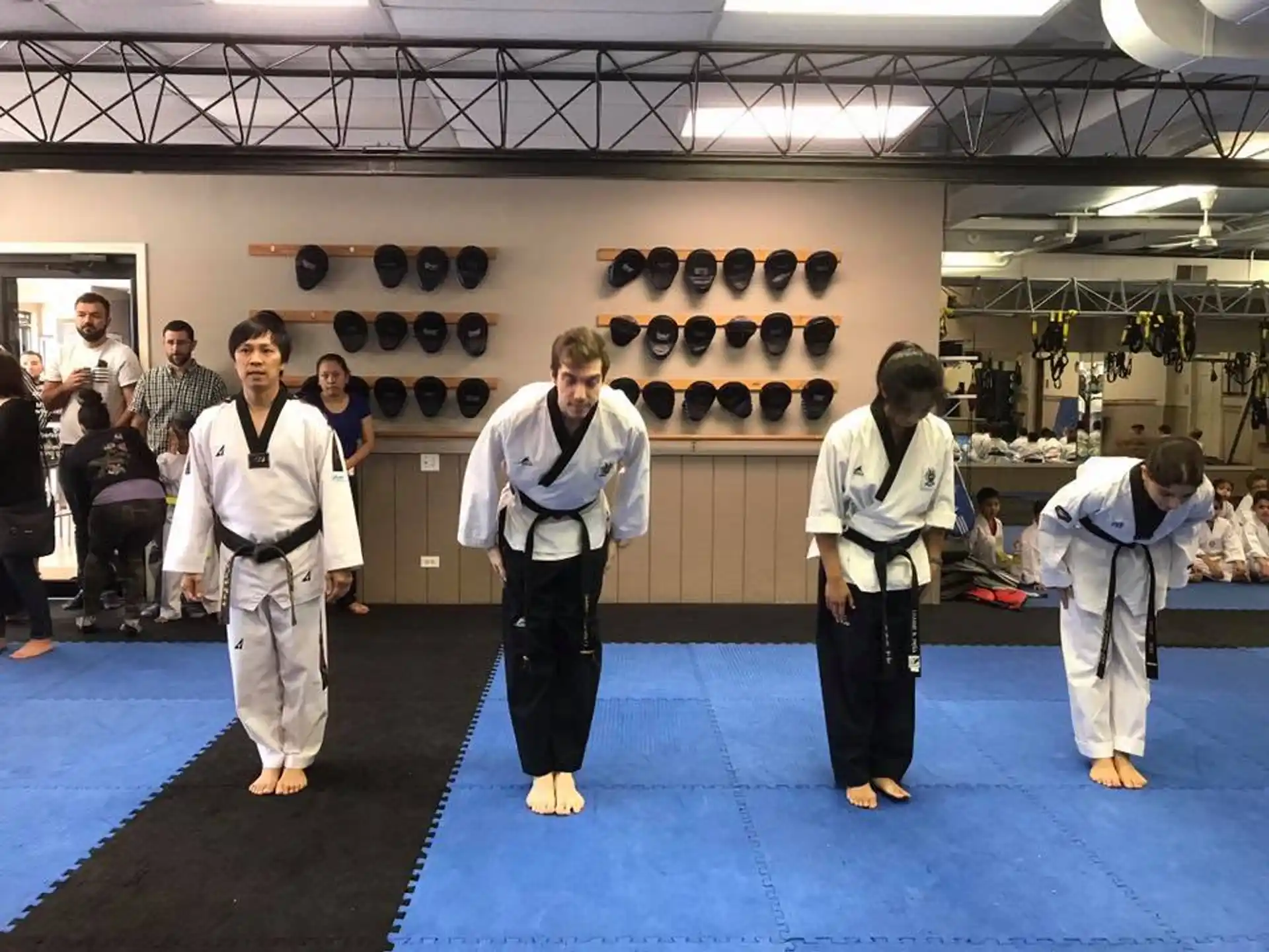 a group of people in karate uniforms