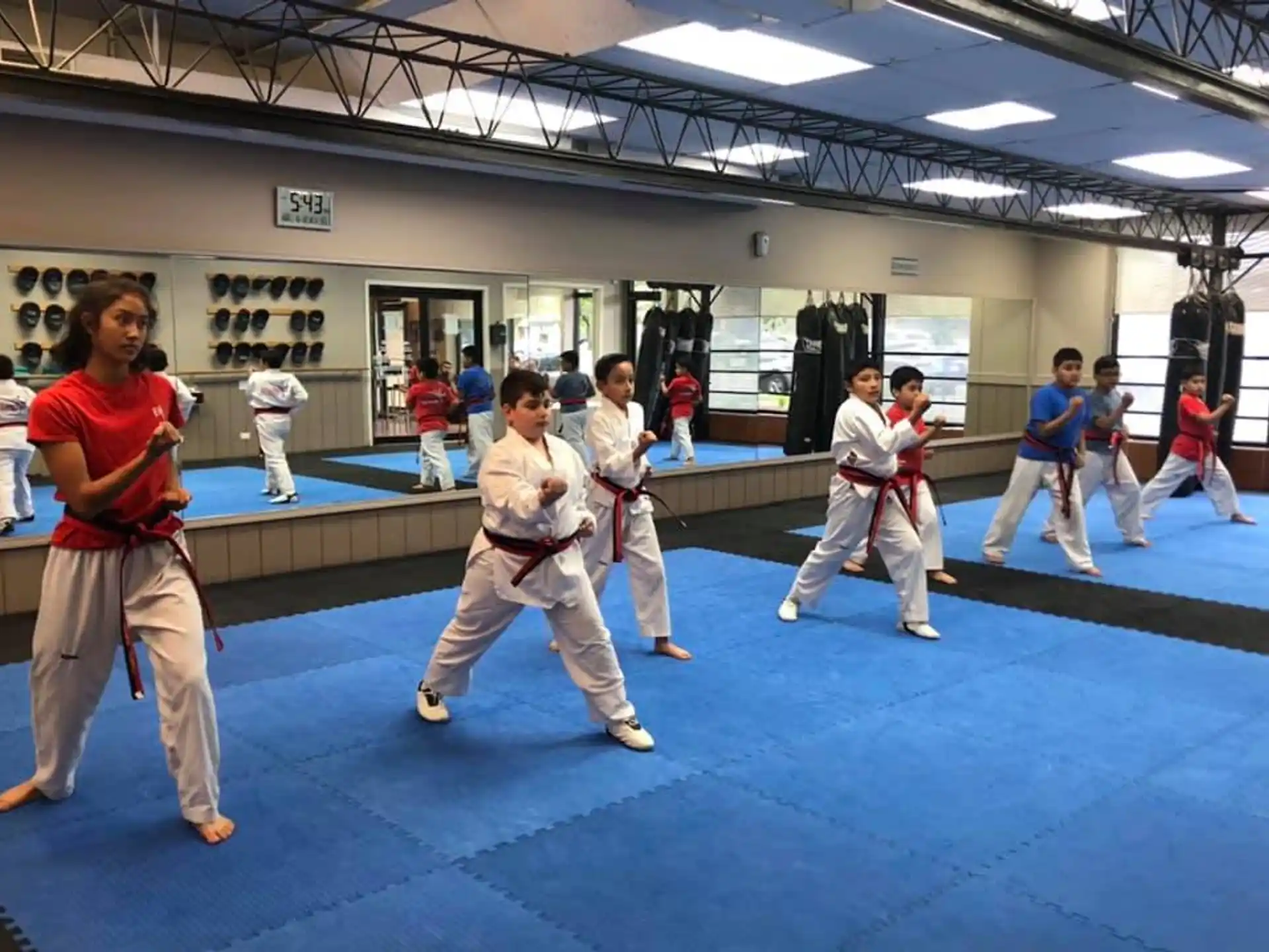 a group of people in karate uniforms