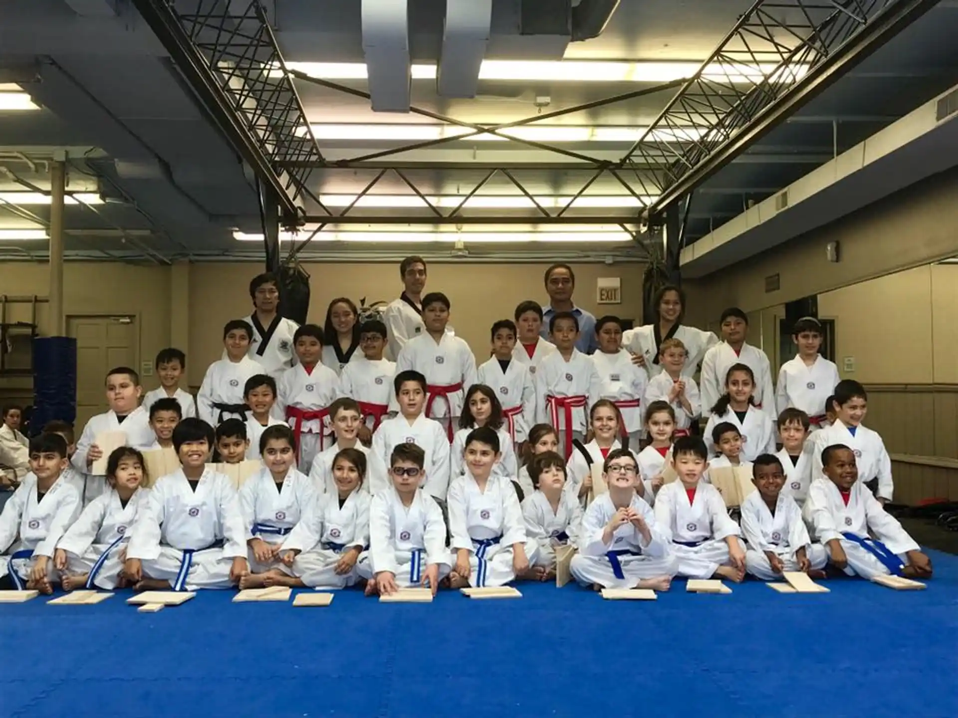 a group of people in white shirts