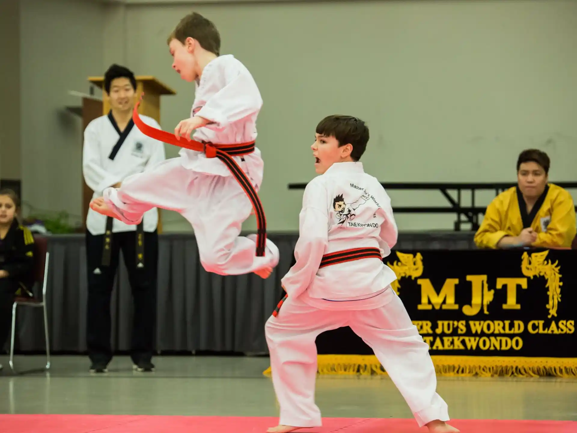 a group of people in karate uniforms
