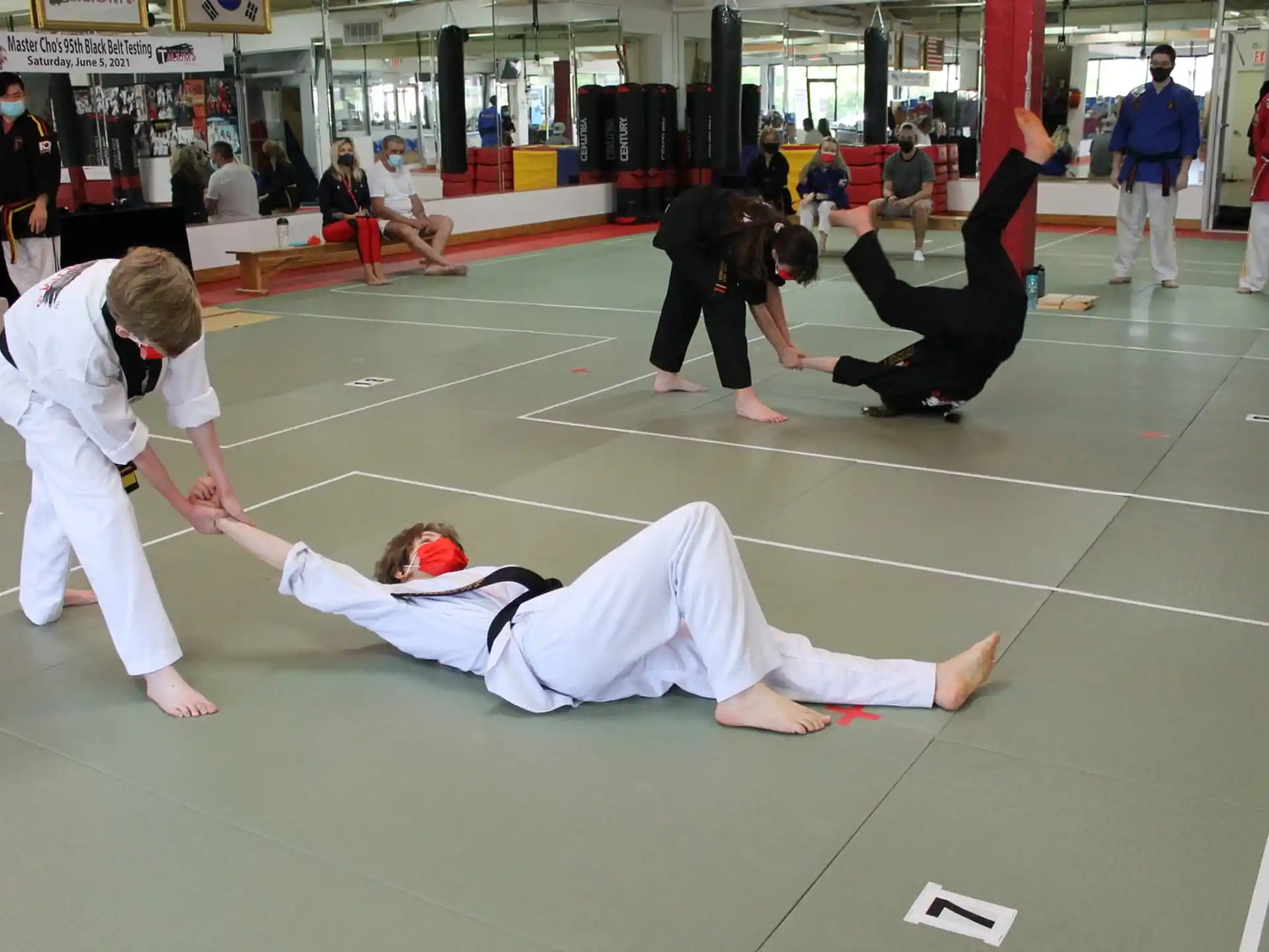 a group of people in karate uniforms