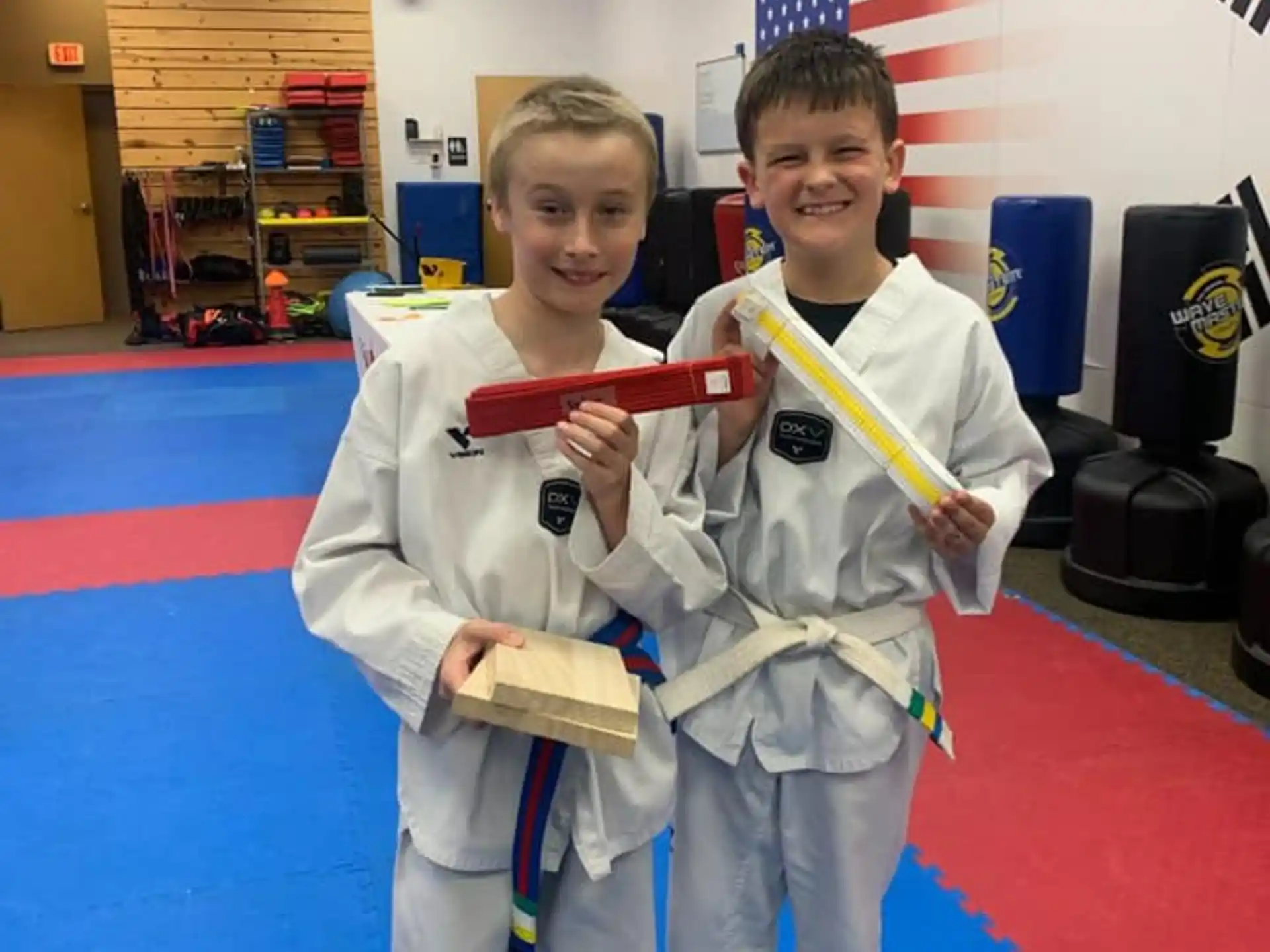 a couple of boys in karate uniforms