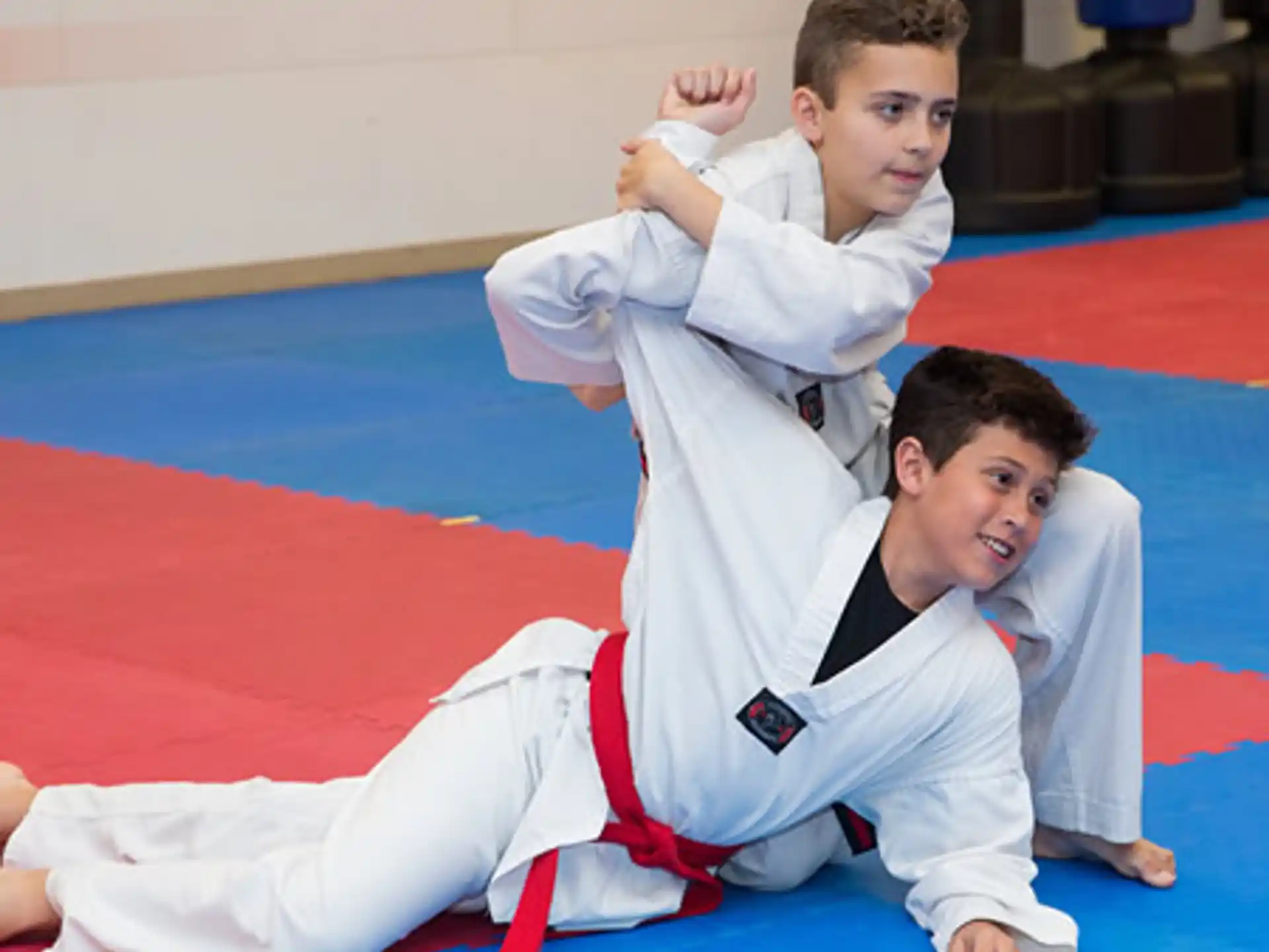a group of boys in karate uniforms