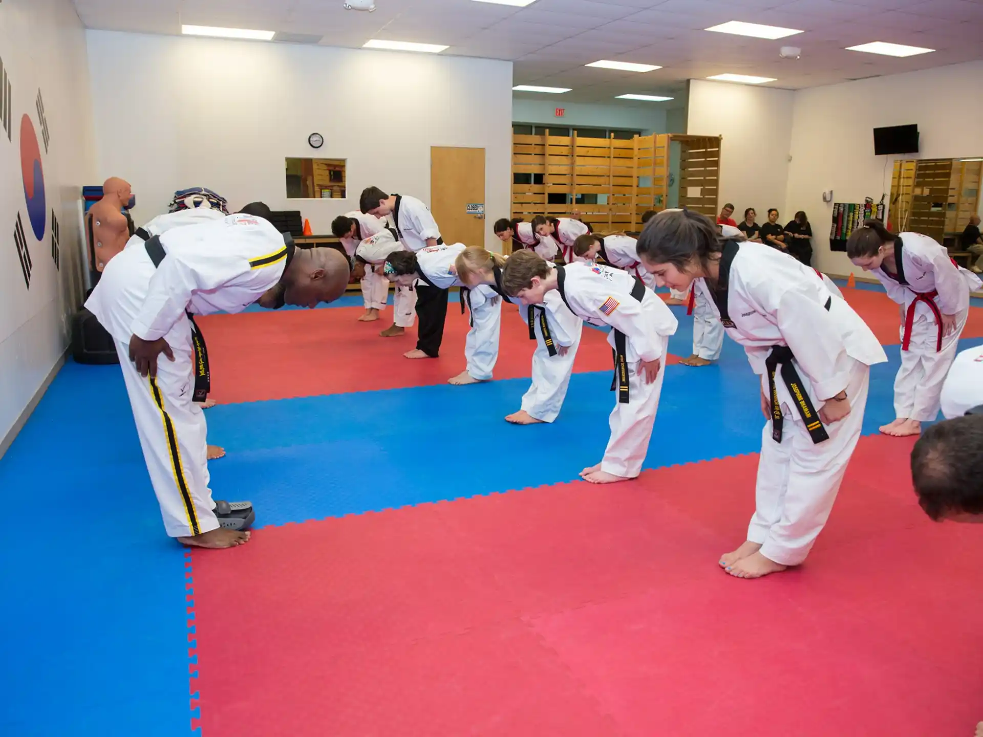 a group of people in karate uniforms