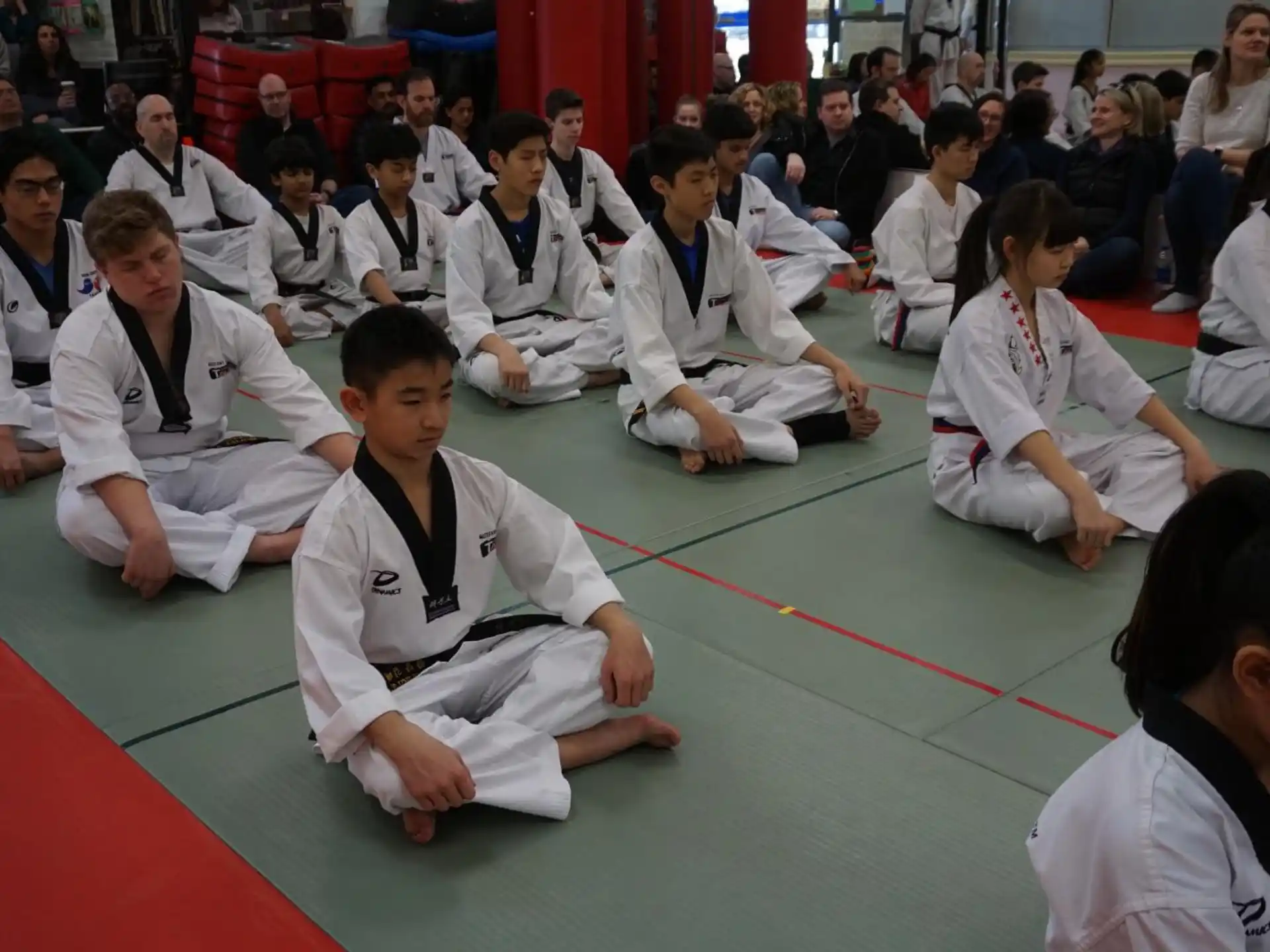 a group of people sitting on the floor