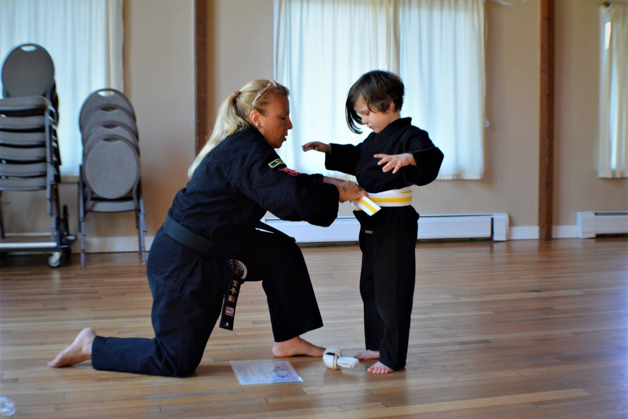 a person and a boy practicing karate
