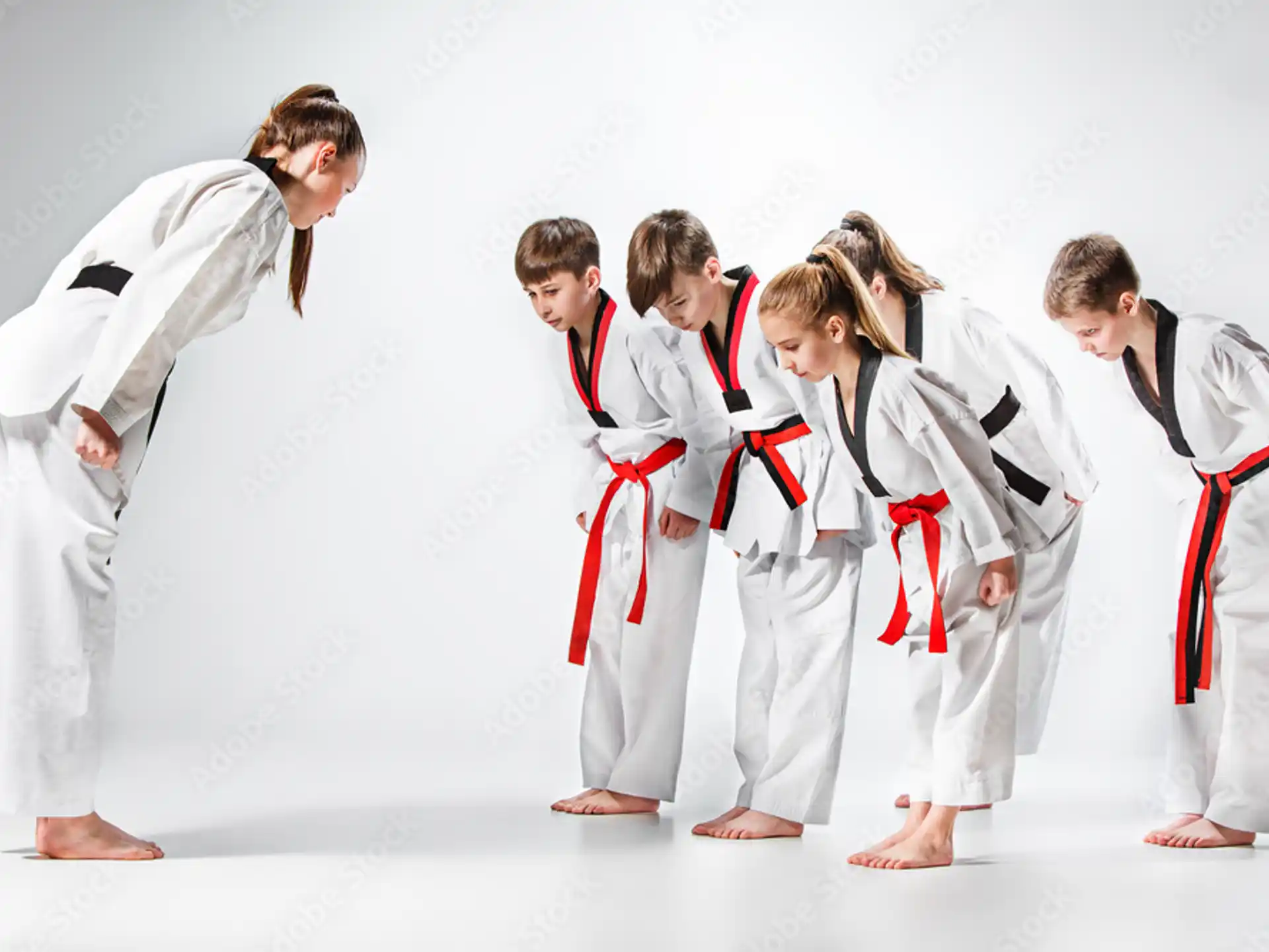 a group of people in karate uniforms
