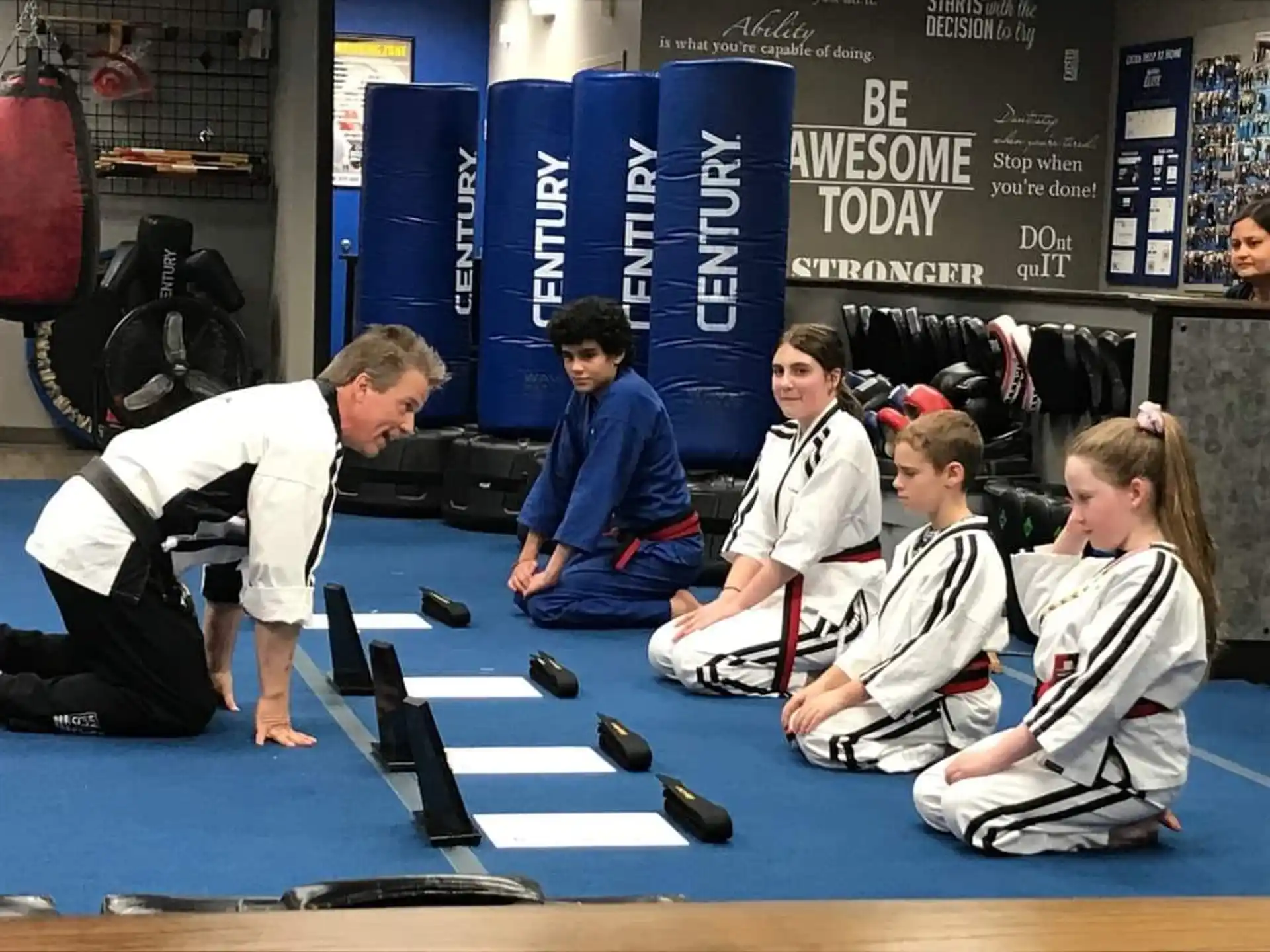 a group of people sitting on a mat