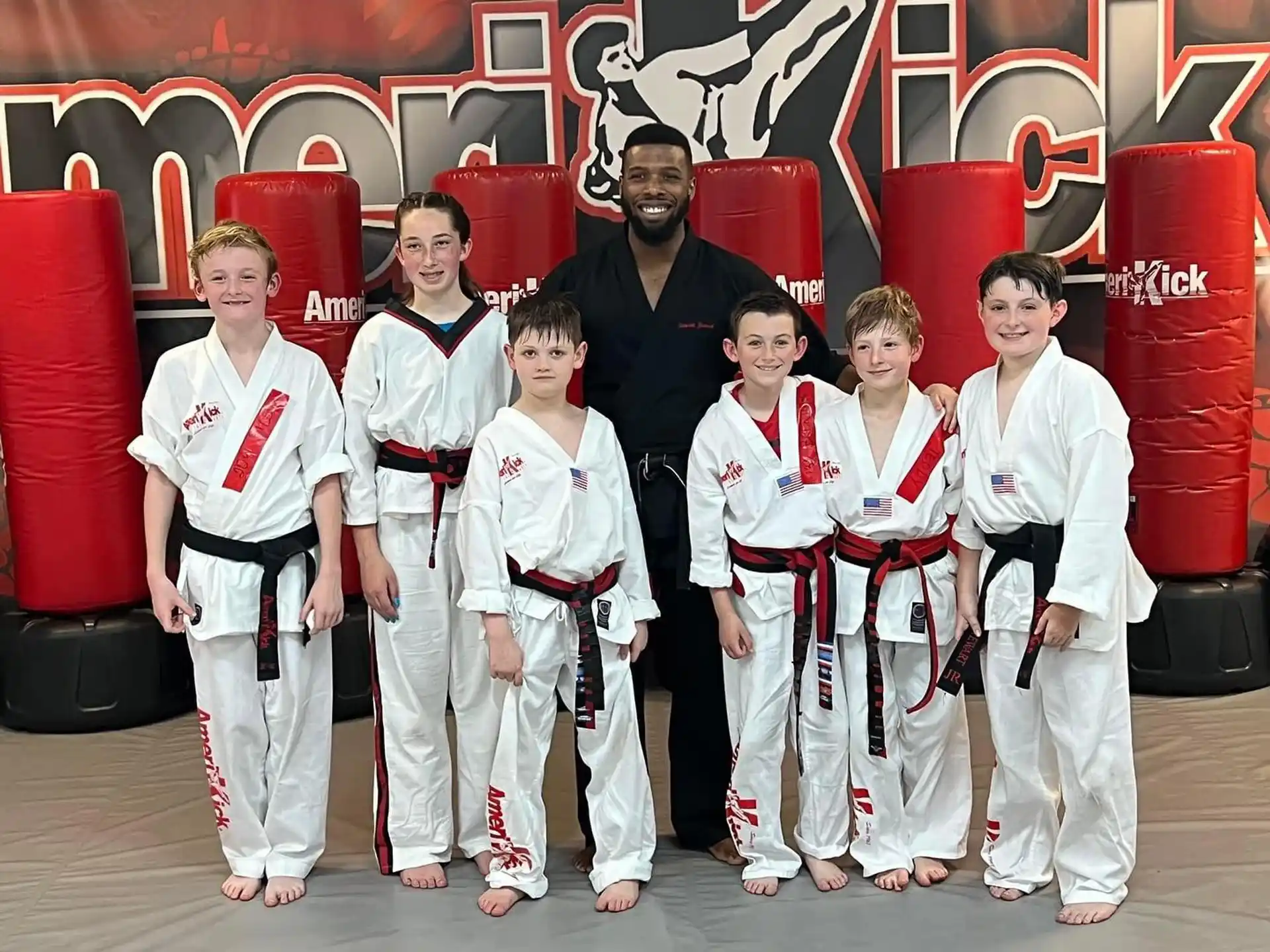 a group of people in karate uniforms