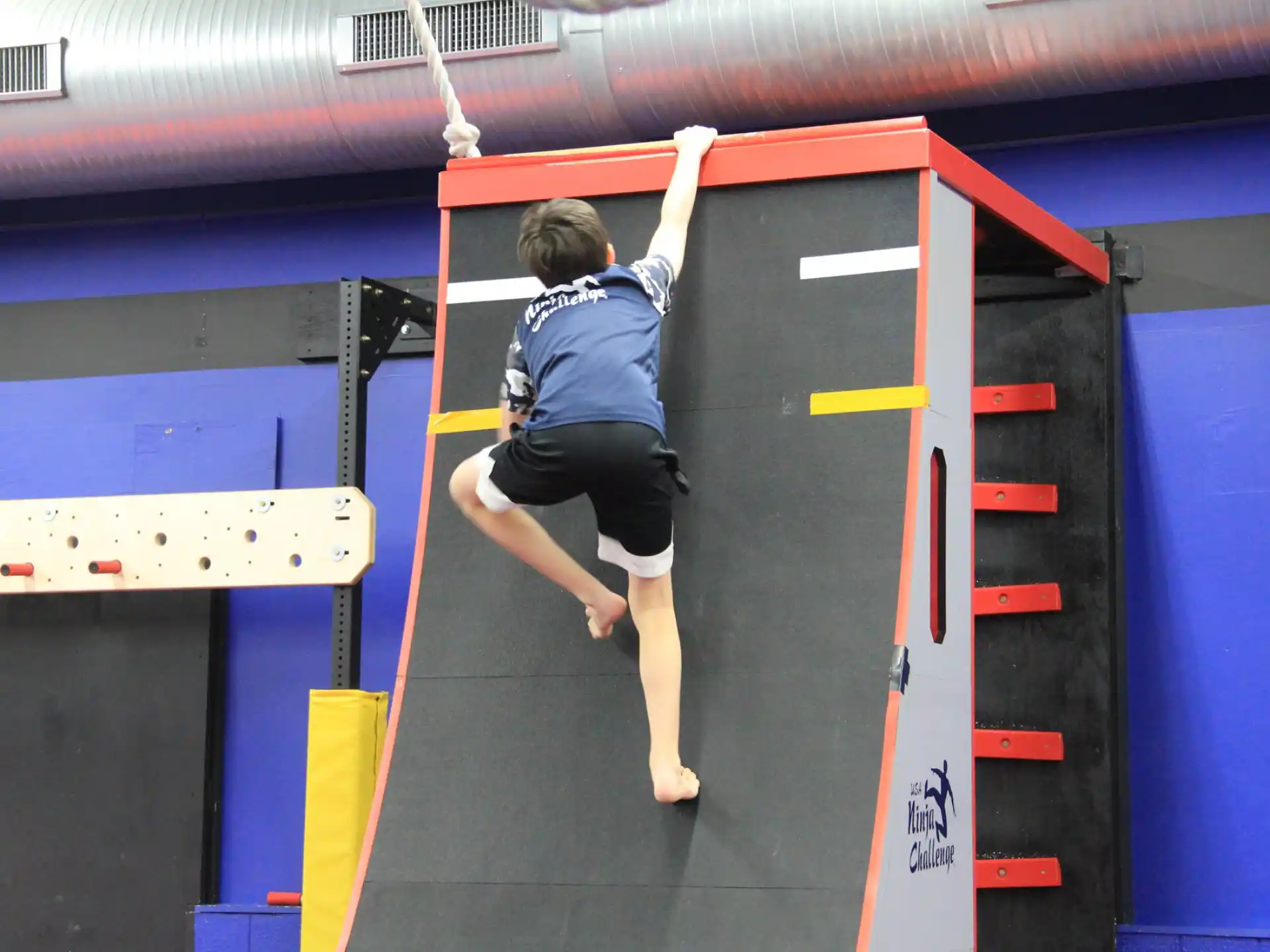 a person jumping on a bar