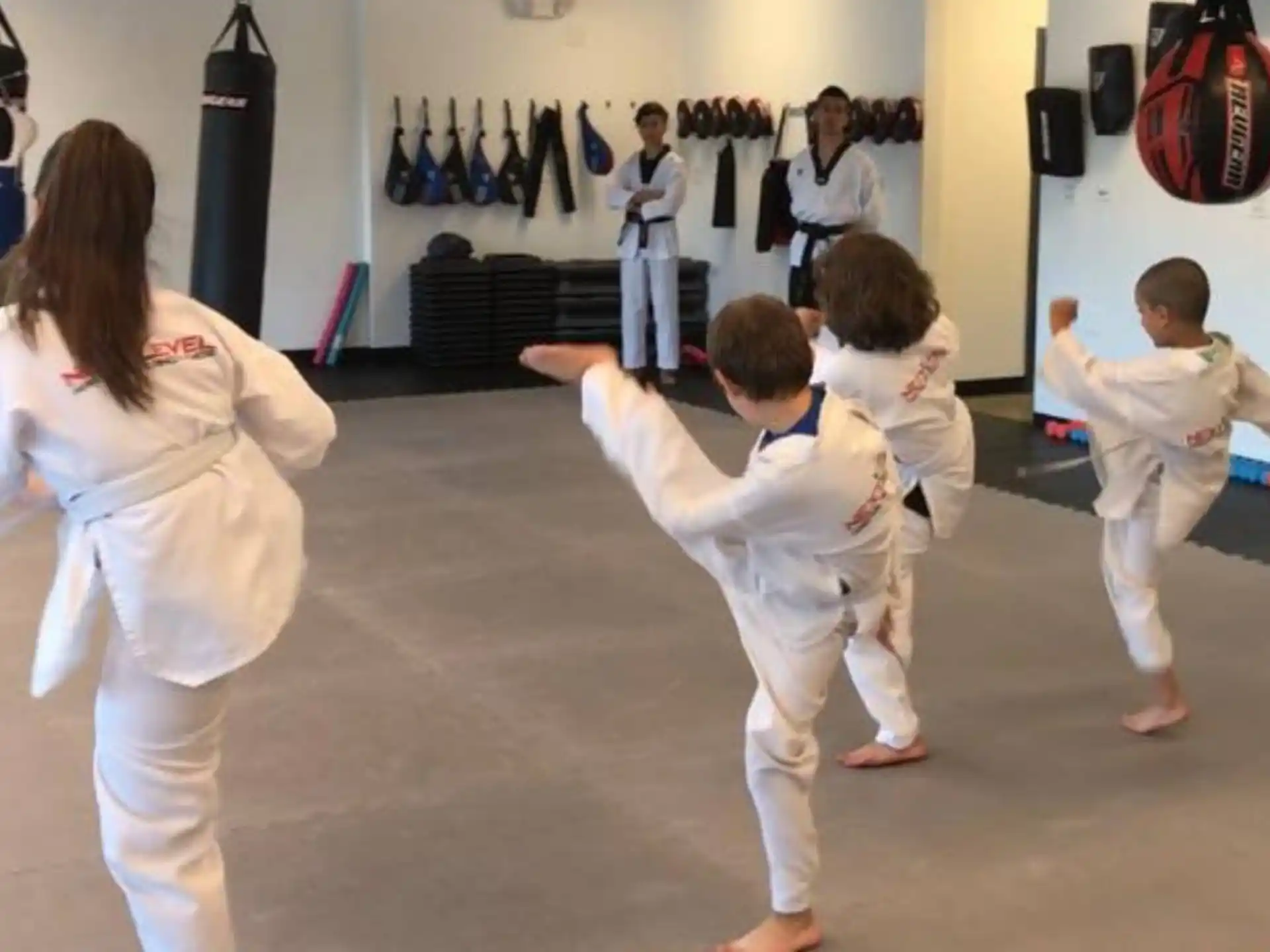 a group of children practicing karate