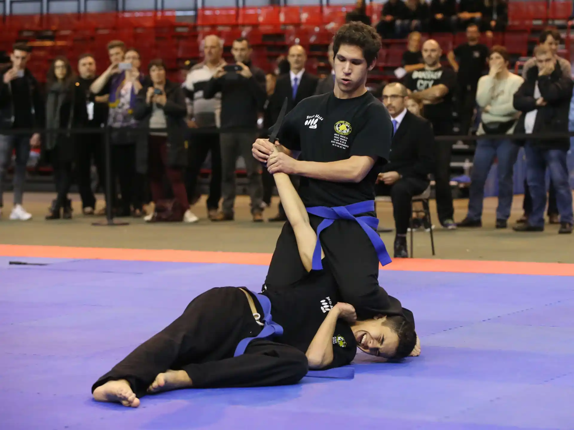 a man and a woman in a martial arts ring