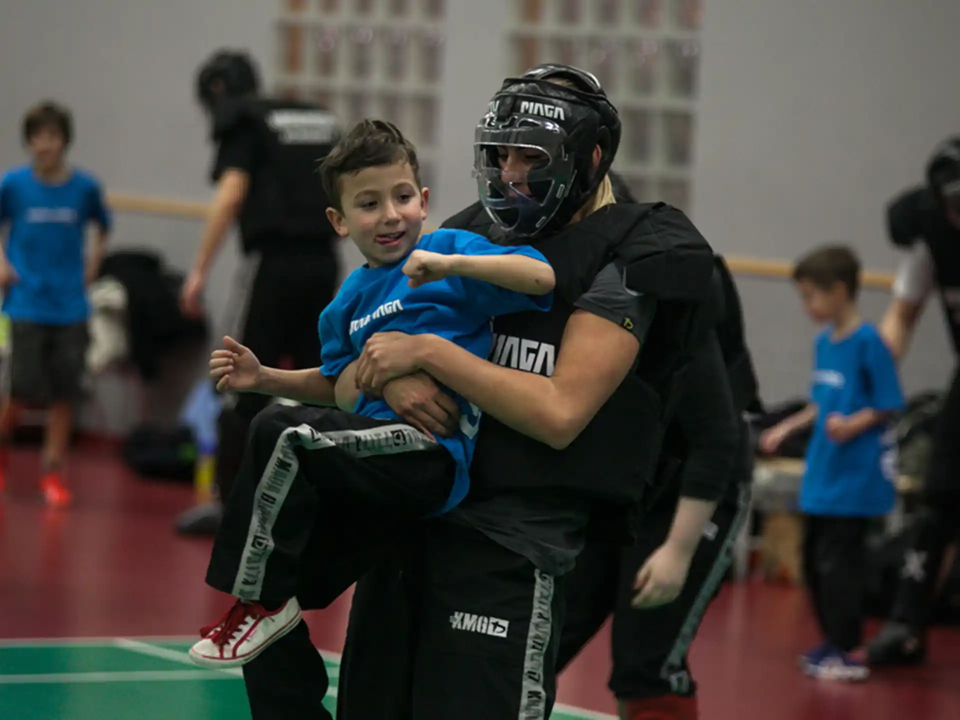 a person holding a boy