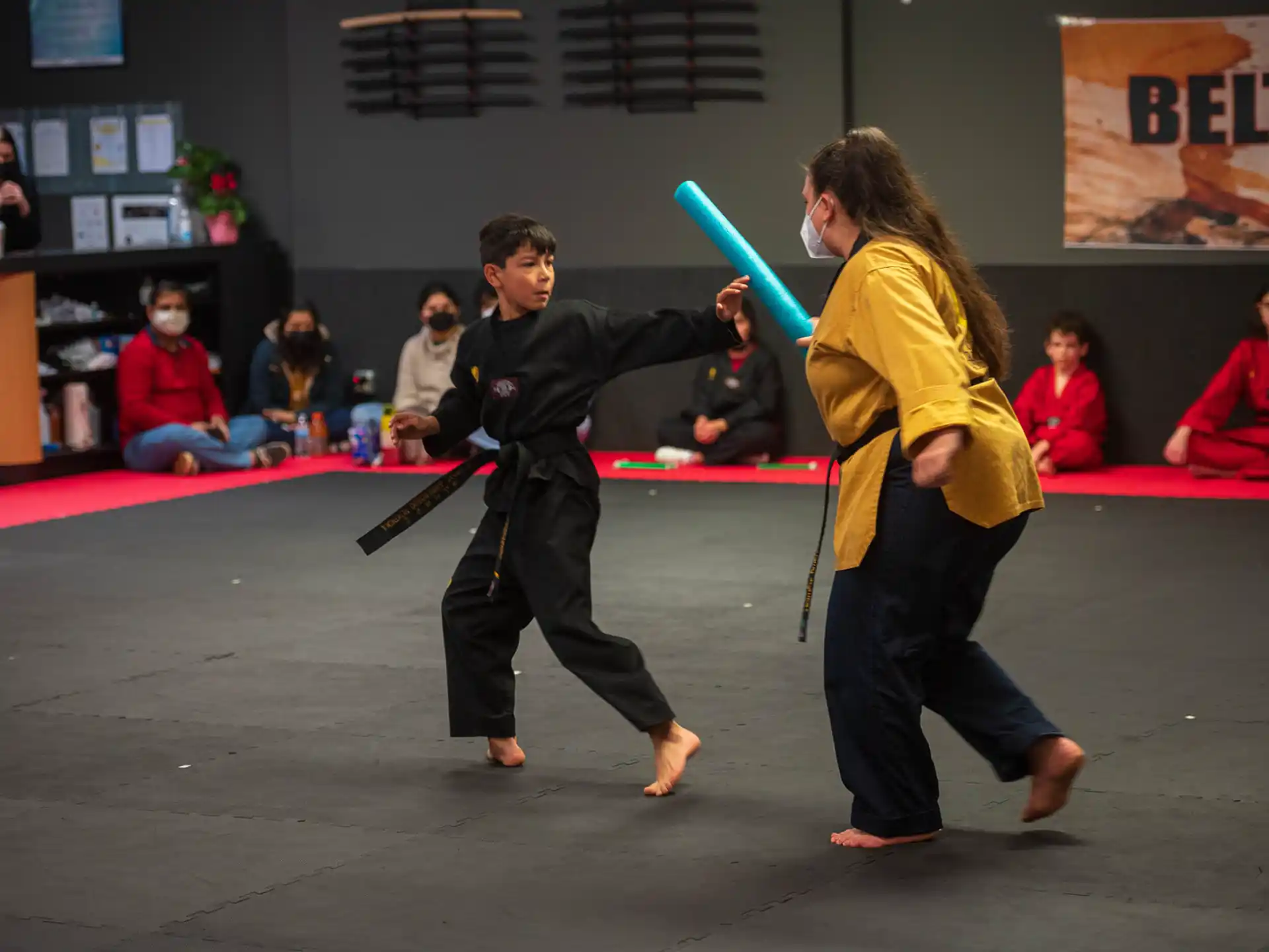 a couple of people in a karate class