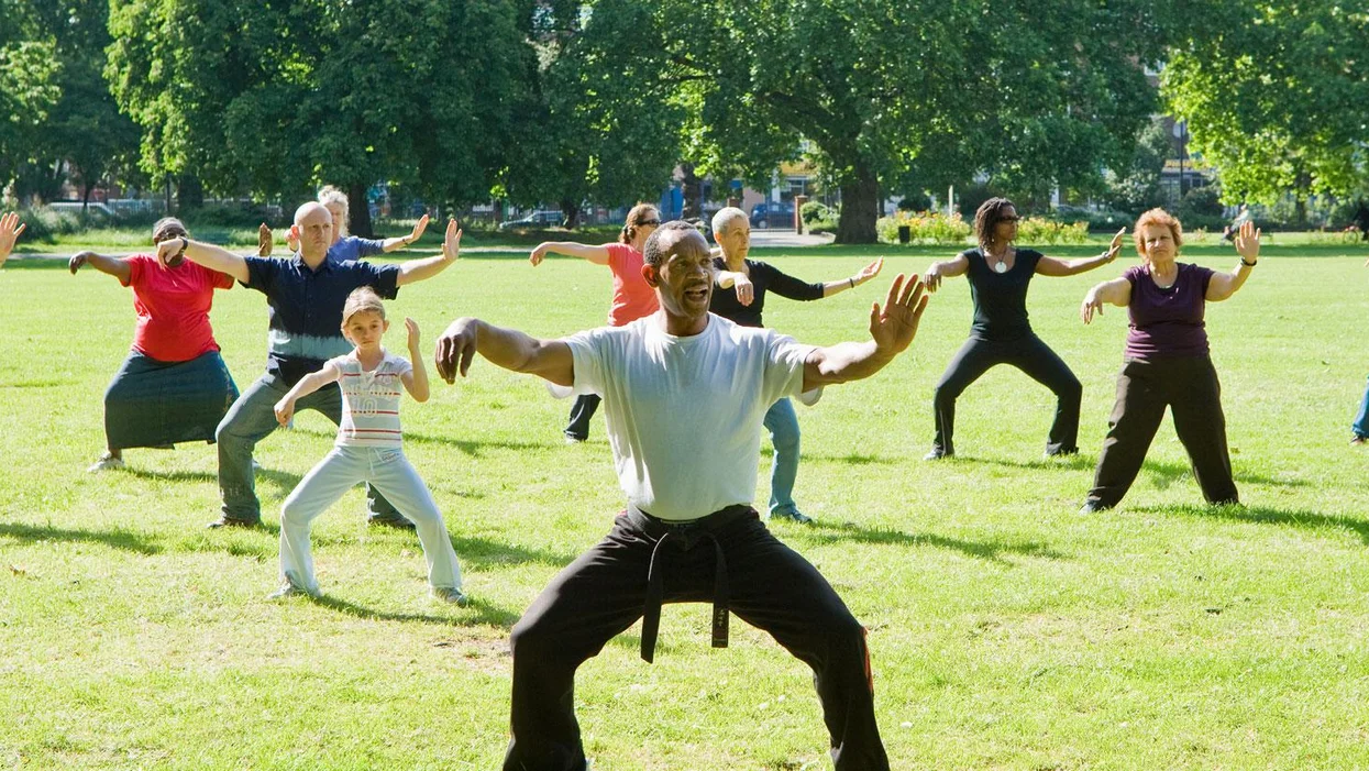 a group of people jumping in the air