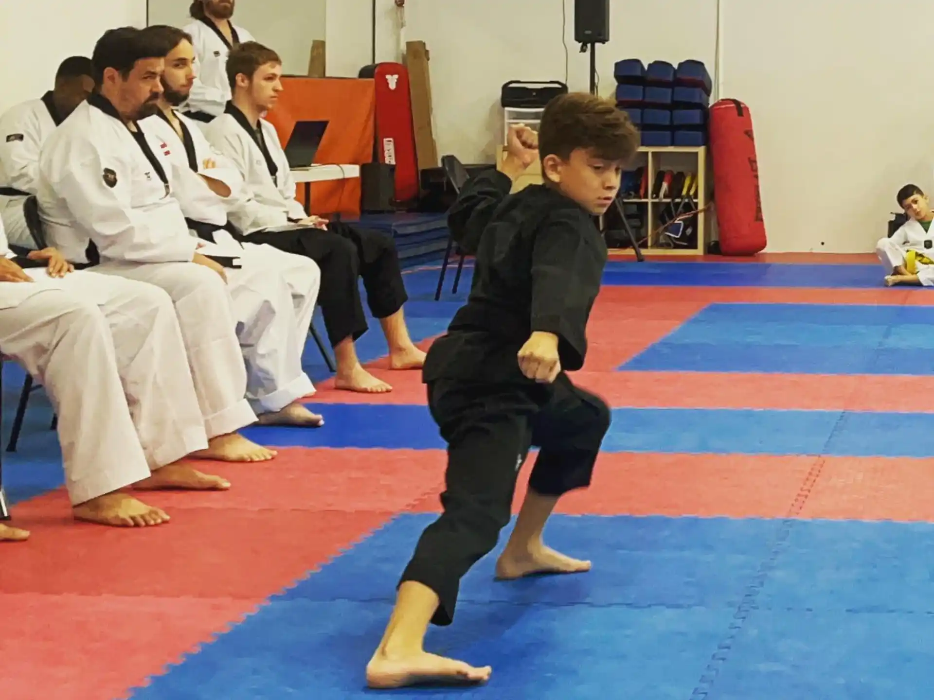 a boy in a karate uniform