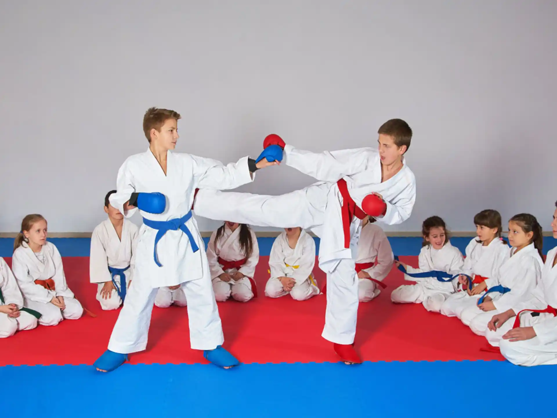 a group of people in karate uniforms