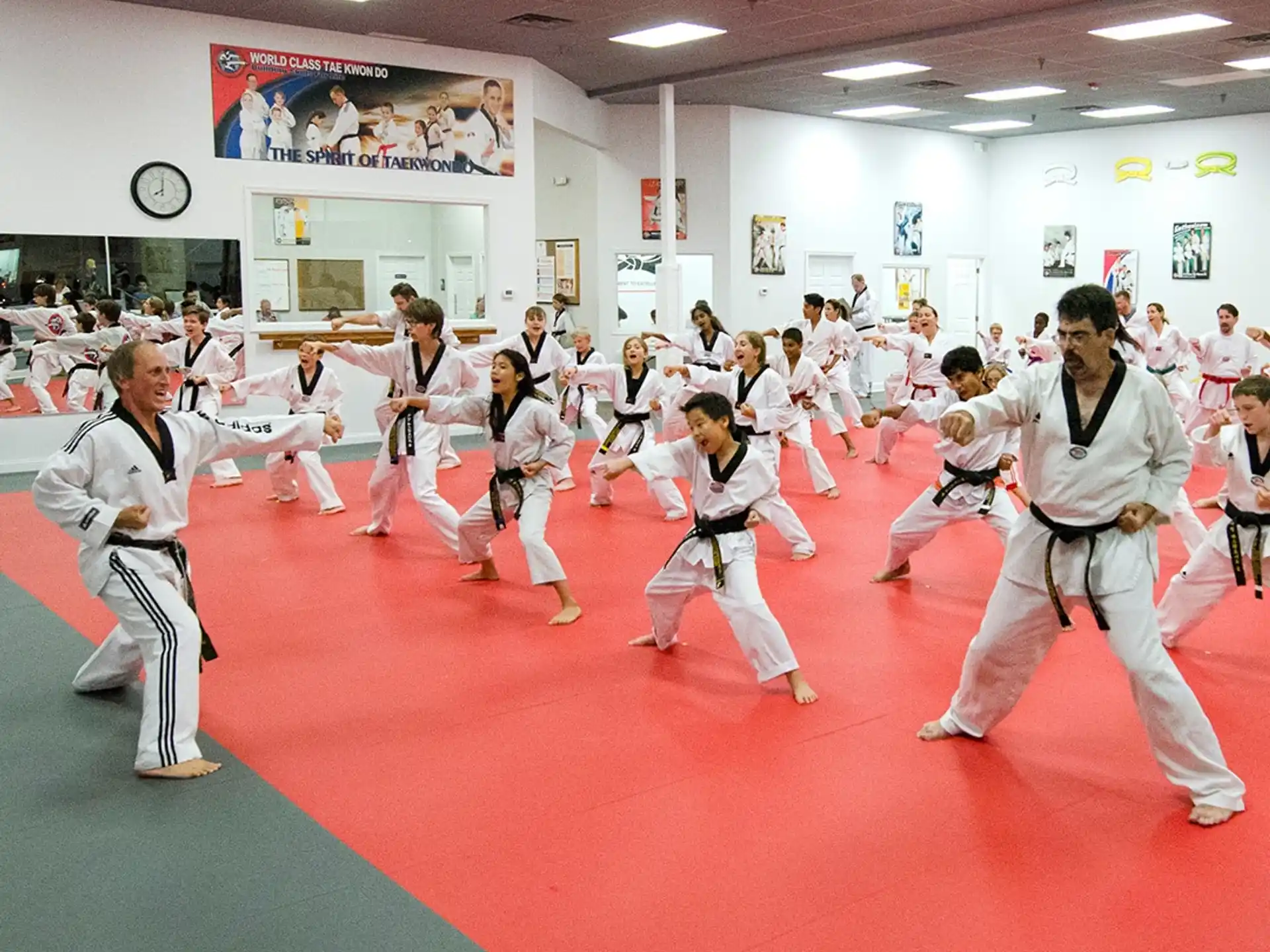a group of people in karate uniforms