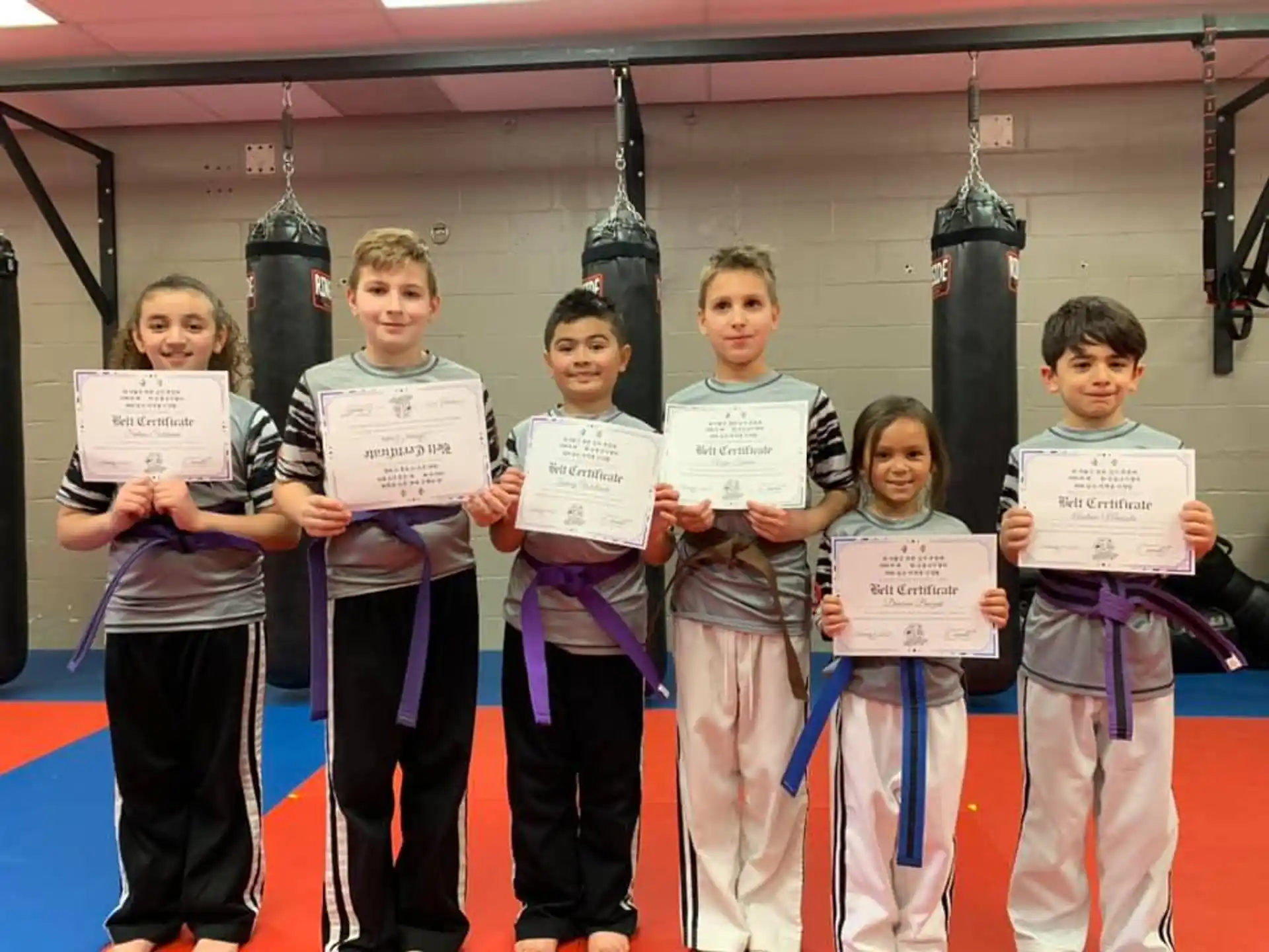 a group of kids holding signs