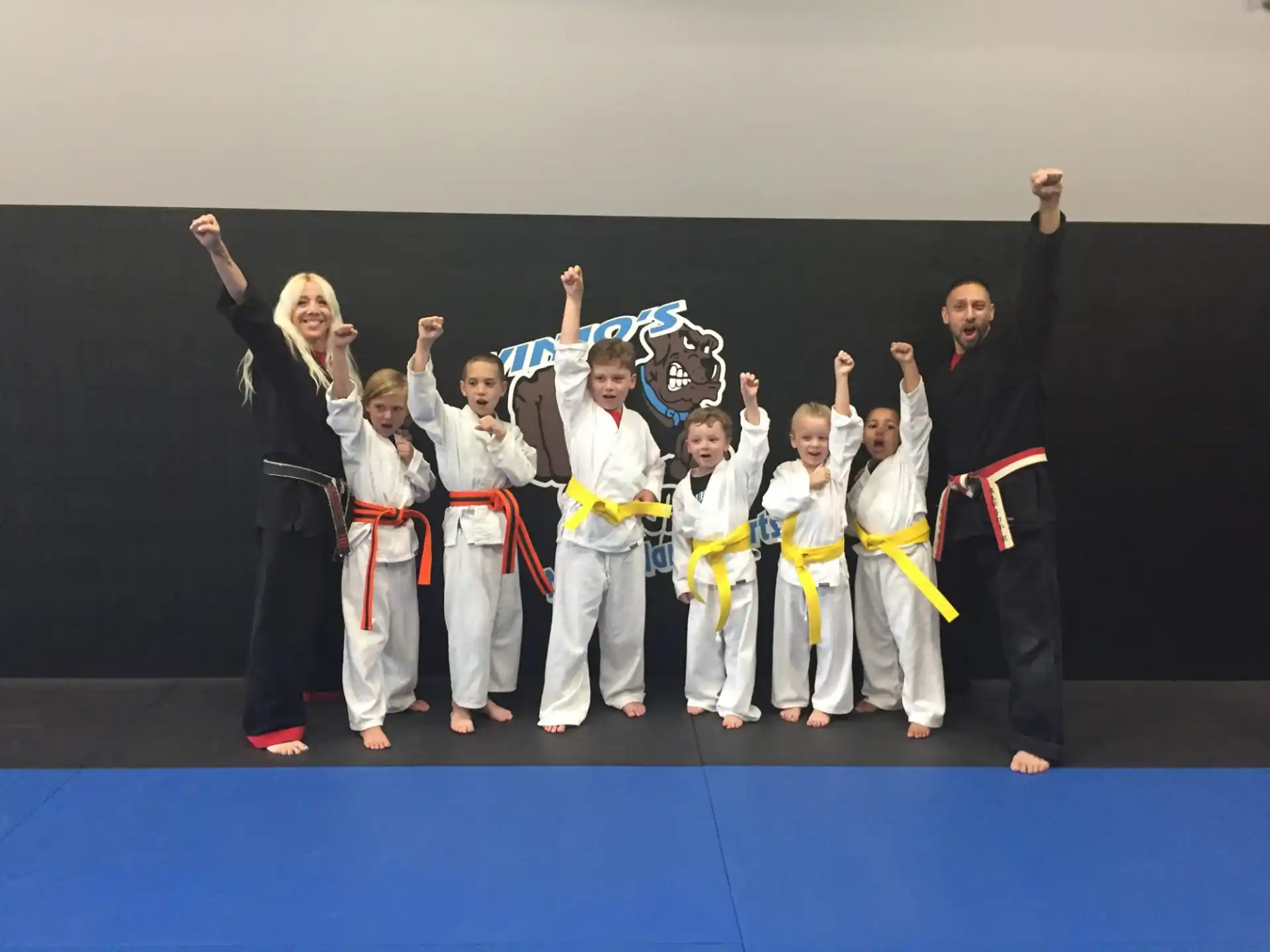 a group of people in karate uniforms