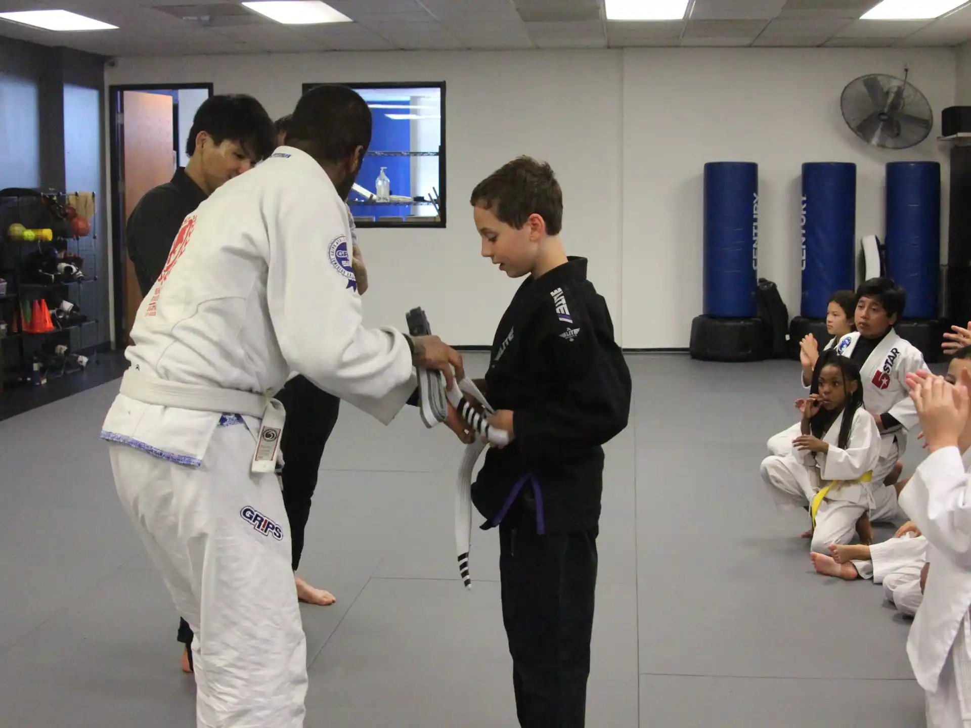 a group of people in karate uniforms