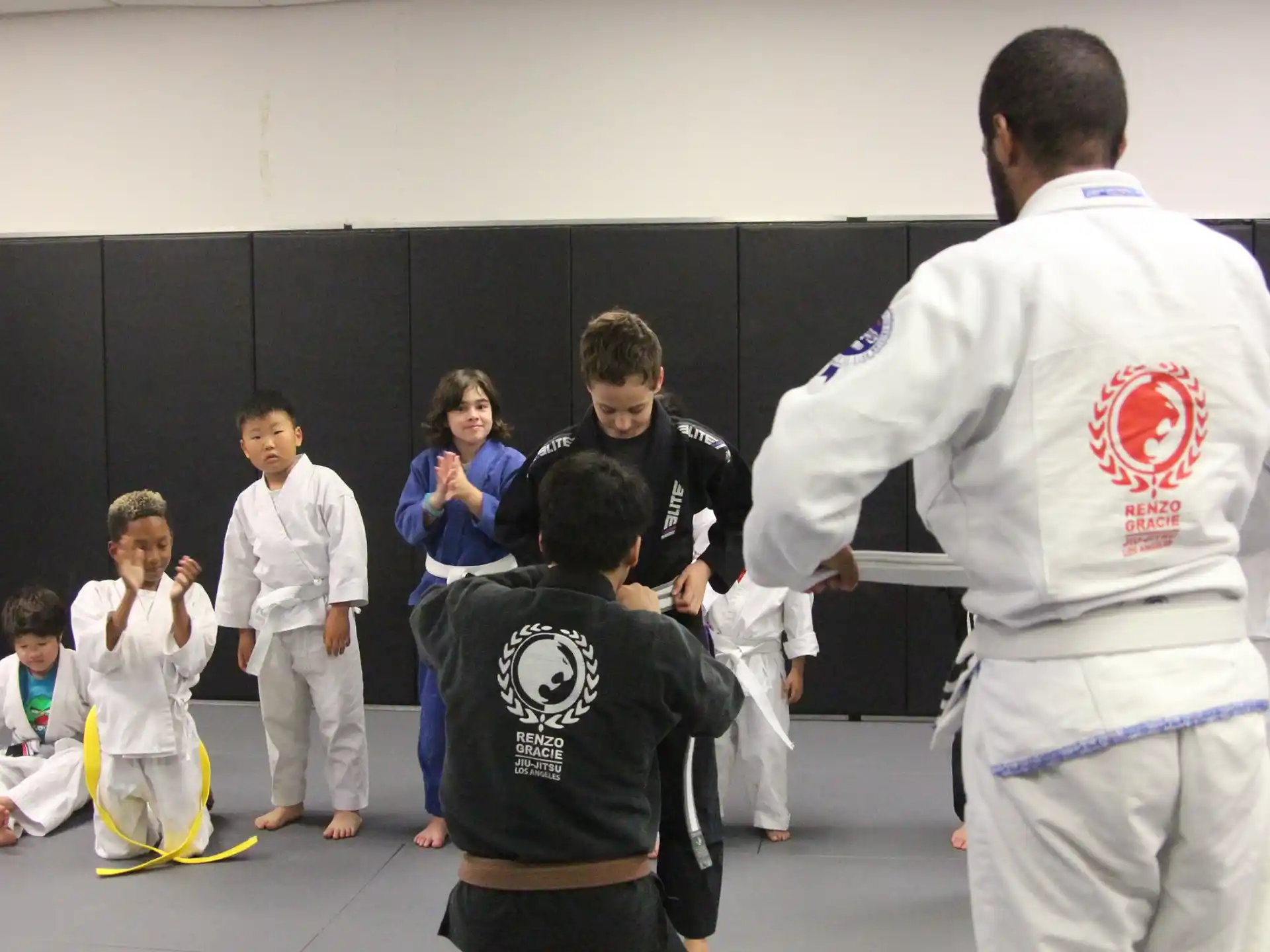 a group of people in karate uniforms