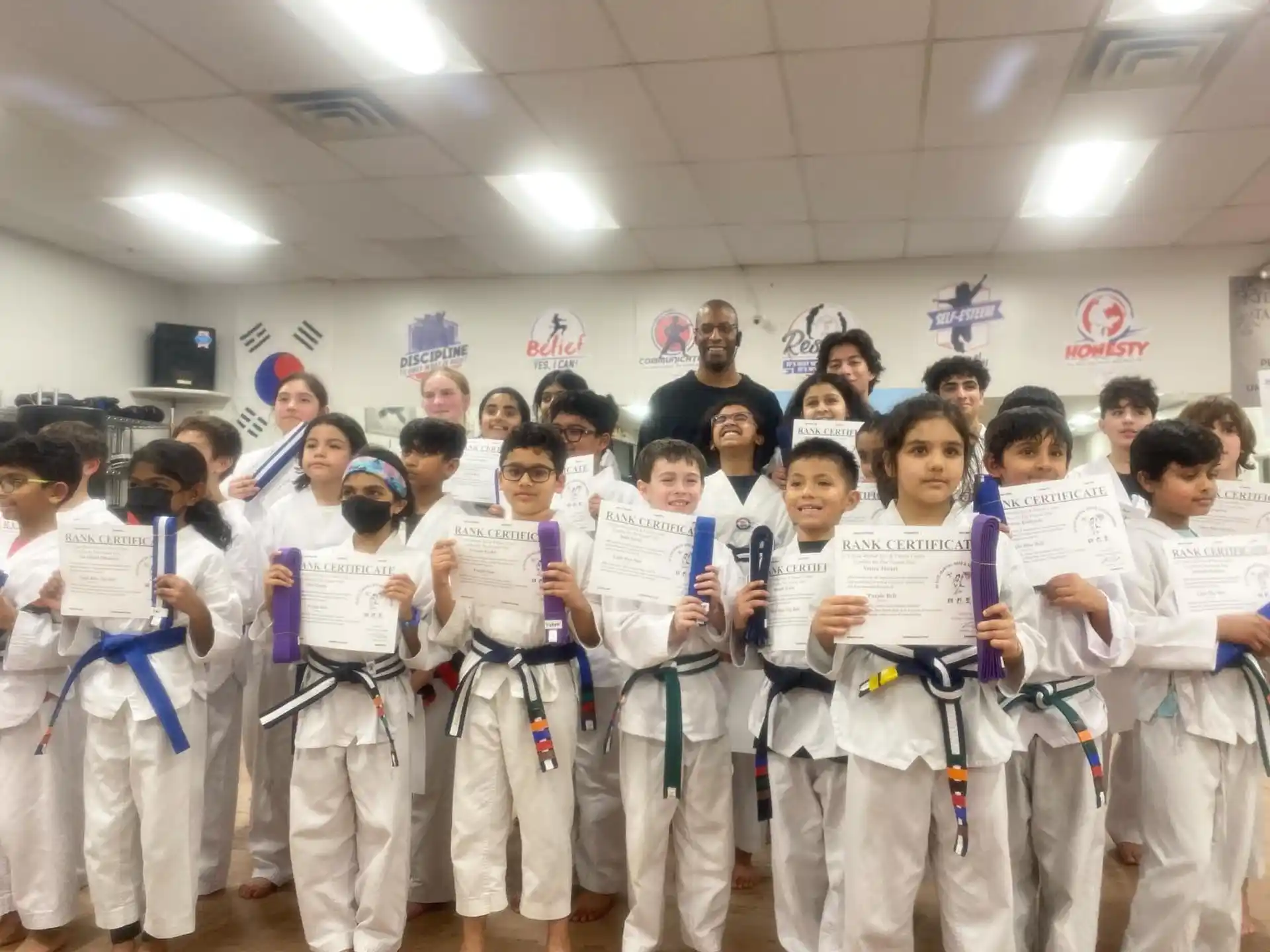 a group of people in karate uniforms