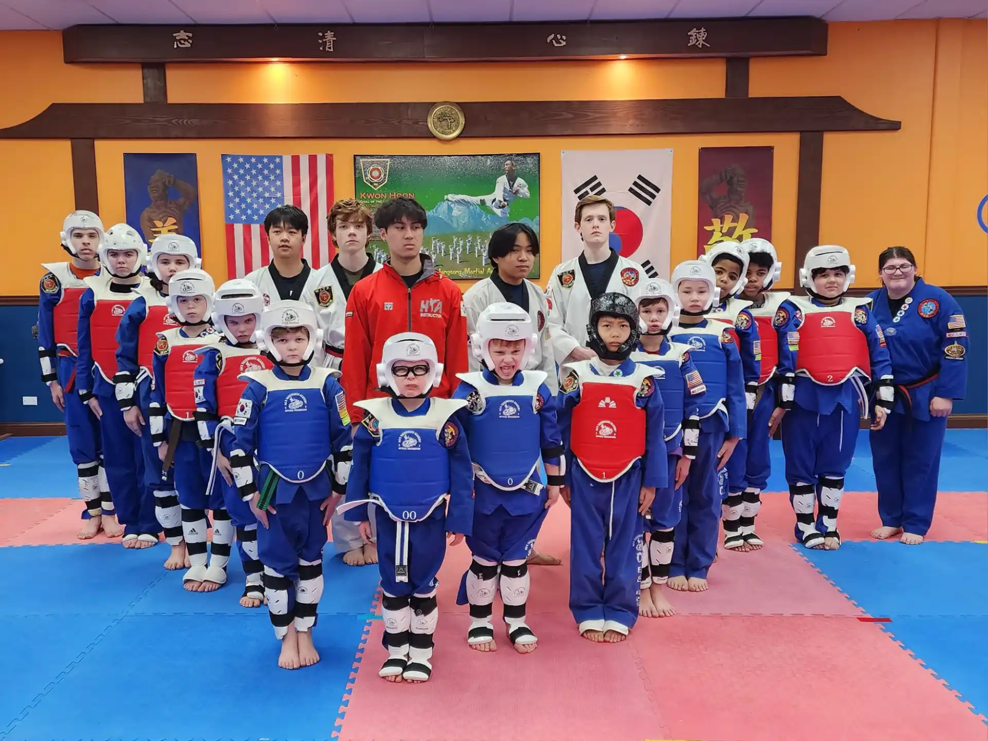 a group of people in blue and red uniforms posing for a photo
