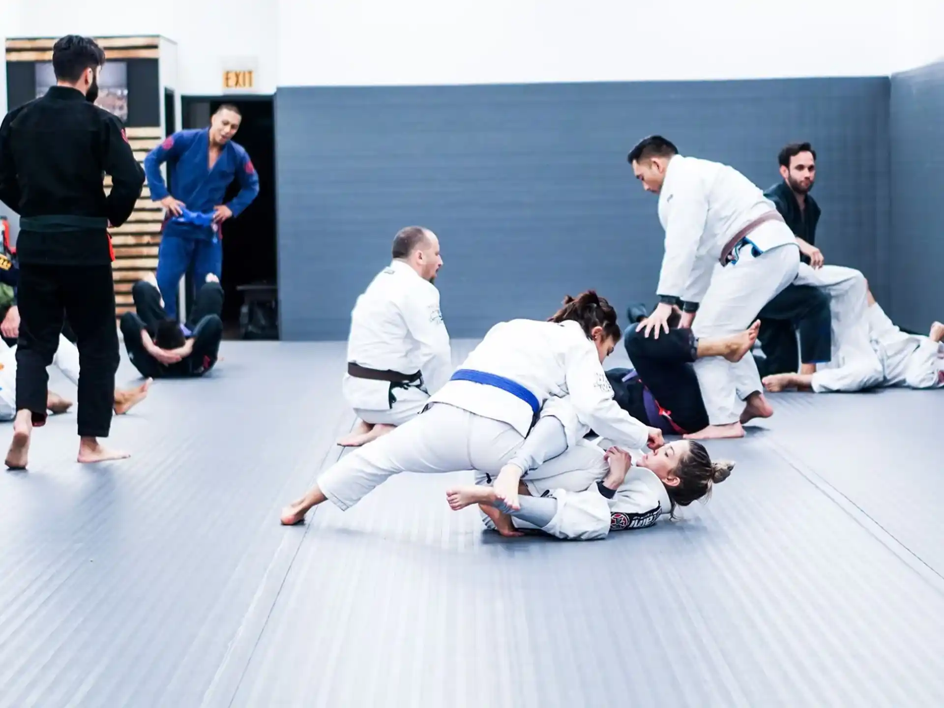 a group of people in karate uniforms