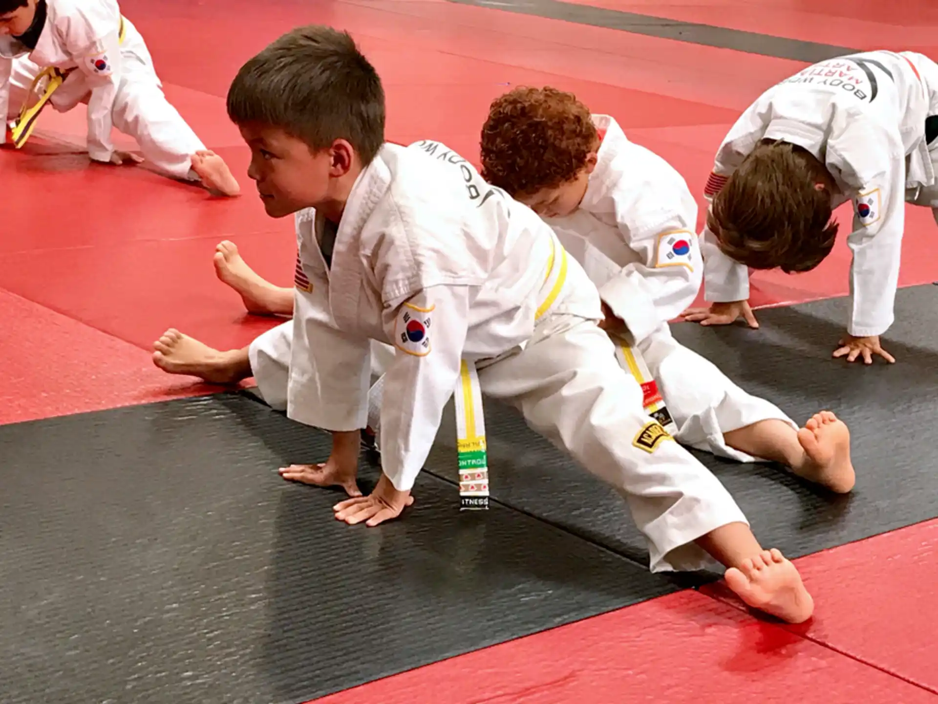 a group of people in karate uniforms