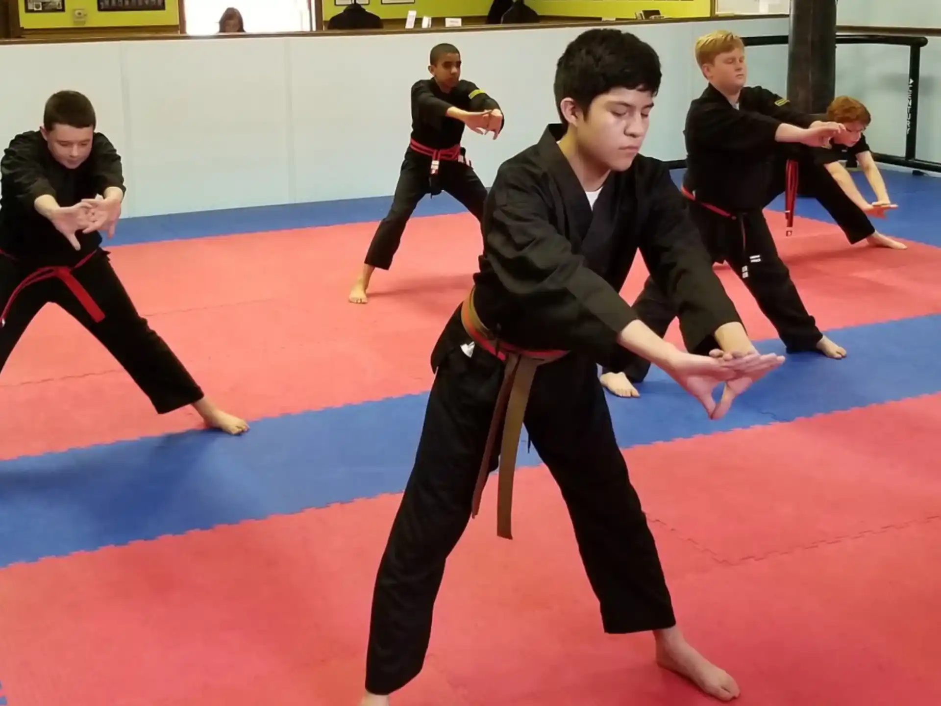 a group of people in a martial arts class