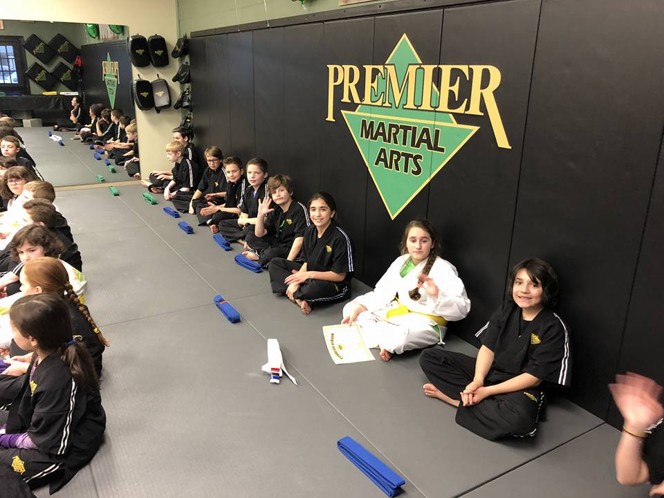 a group of people sitting on the floor