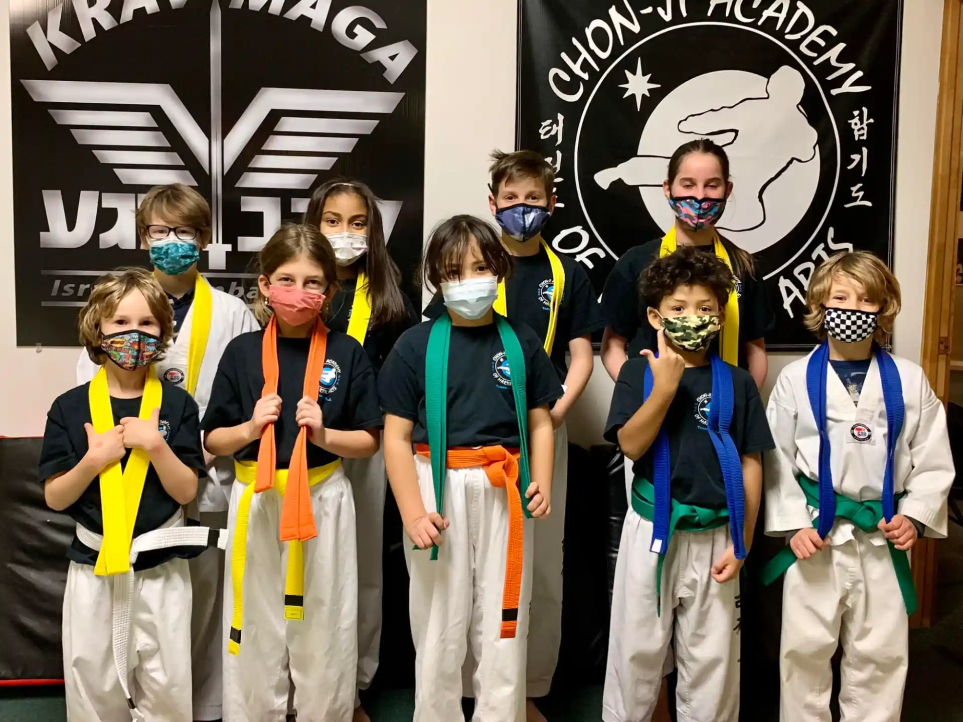 a group of children wearing face masks