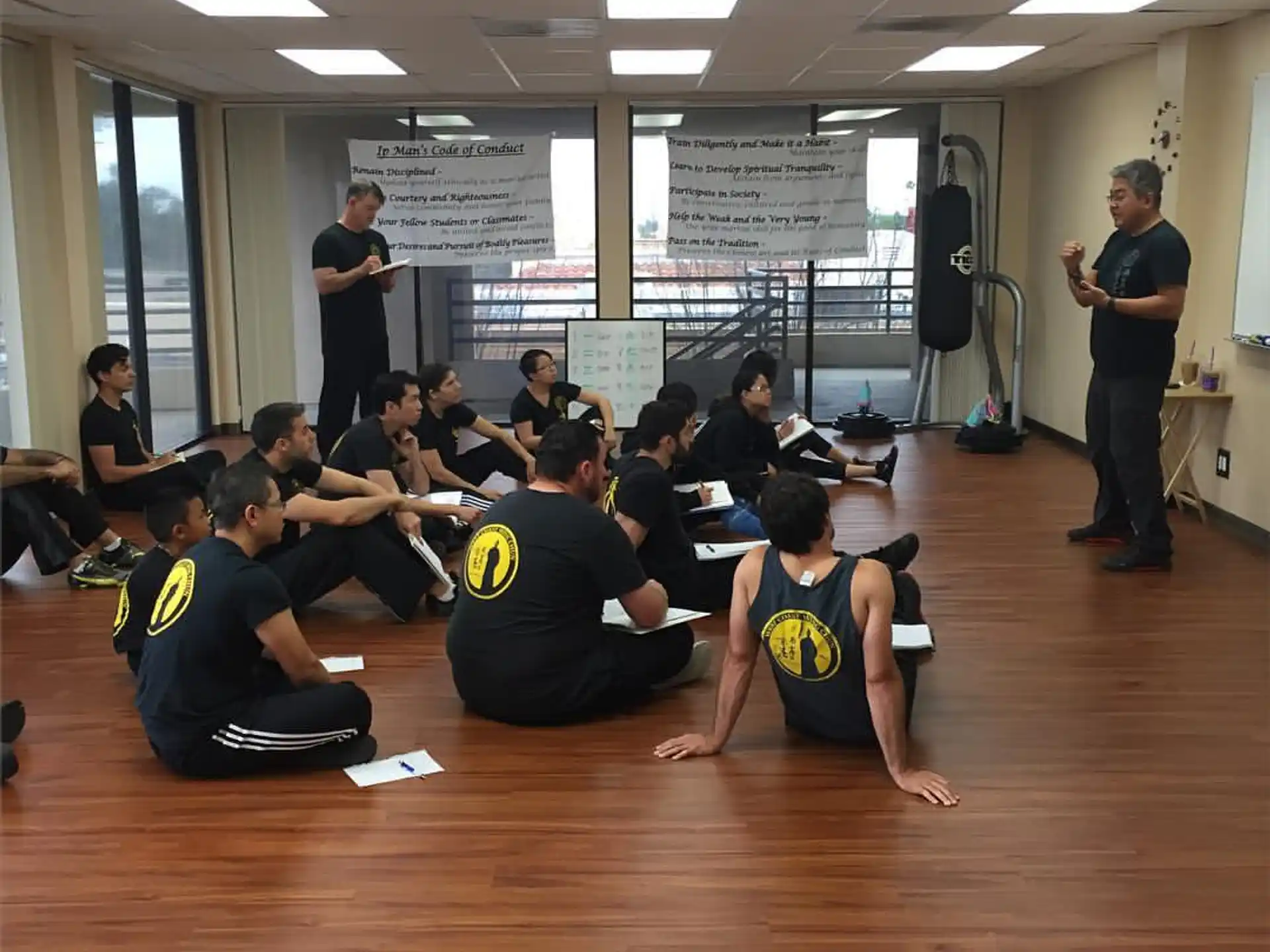 a group of people sitting on the floor in a room