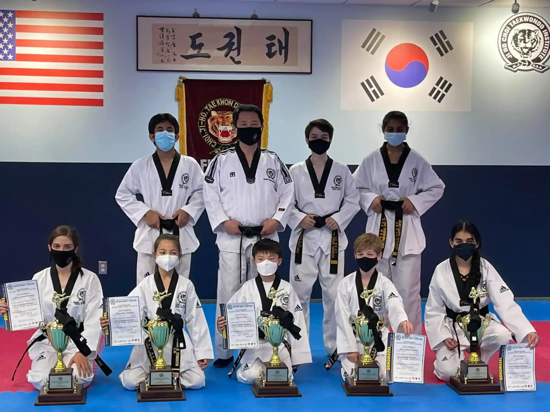 a group of people wearing white outfits