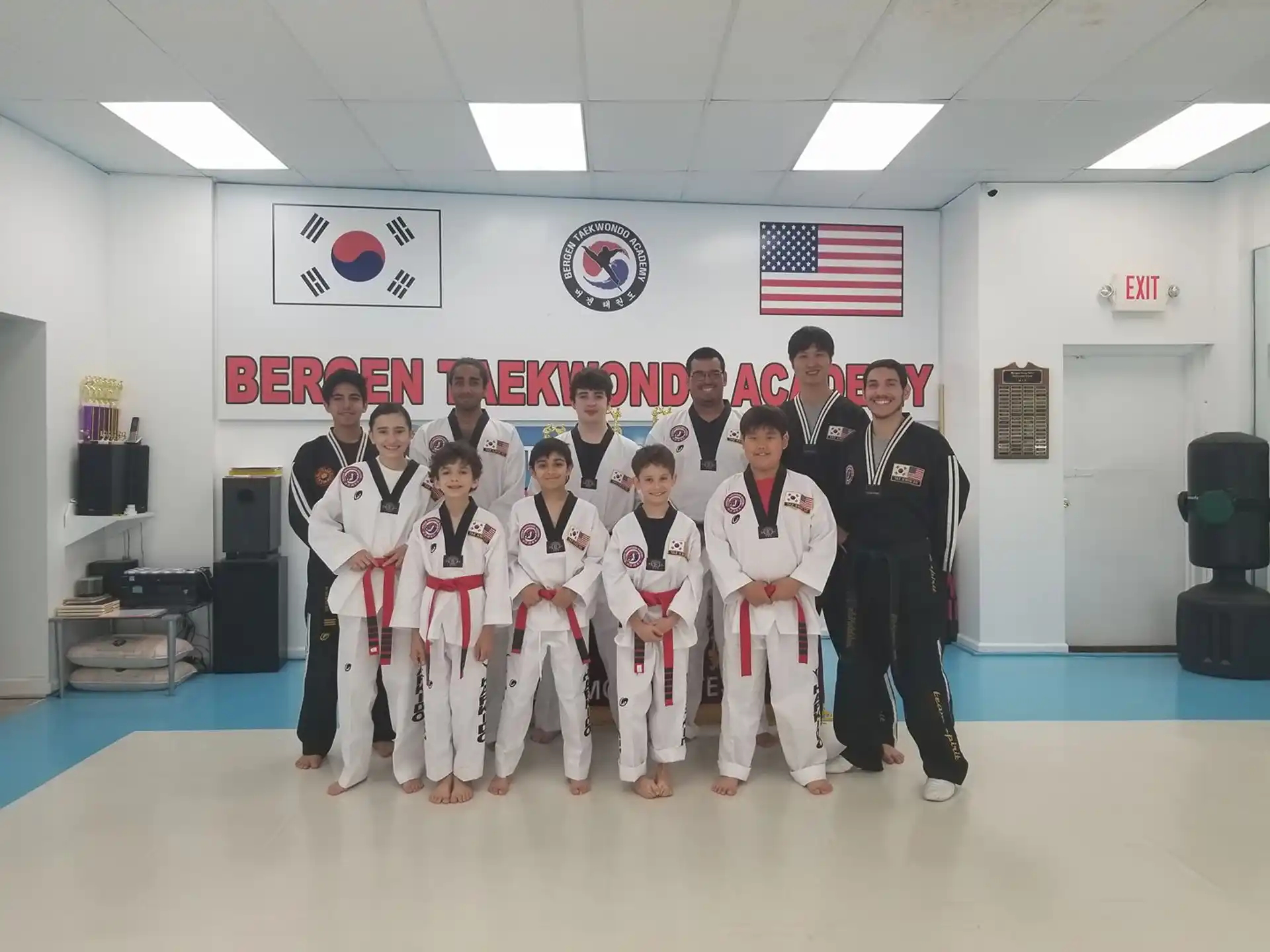 a group of people in karate uniforms