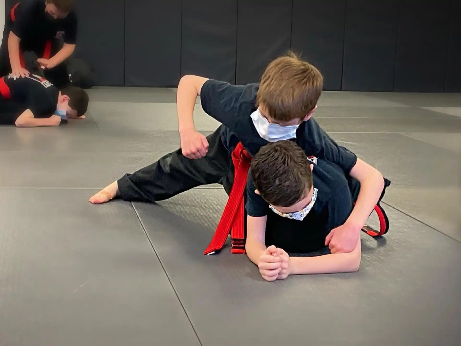 a group of people kneeling on the floor