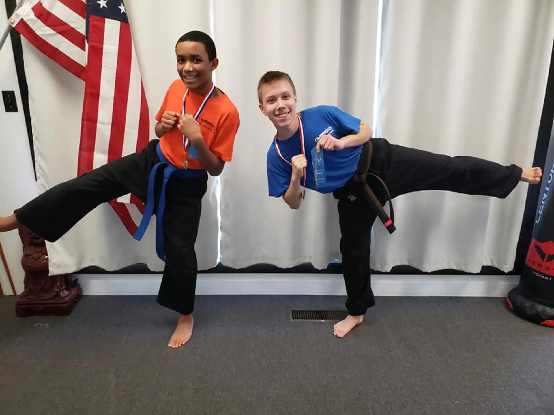 a couple of men in karate uniforms