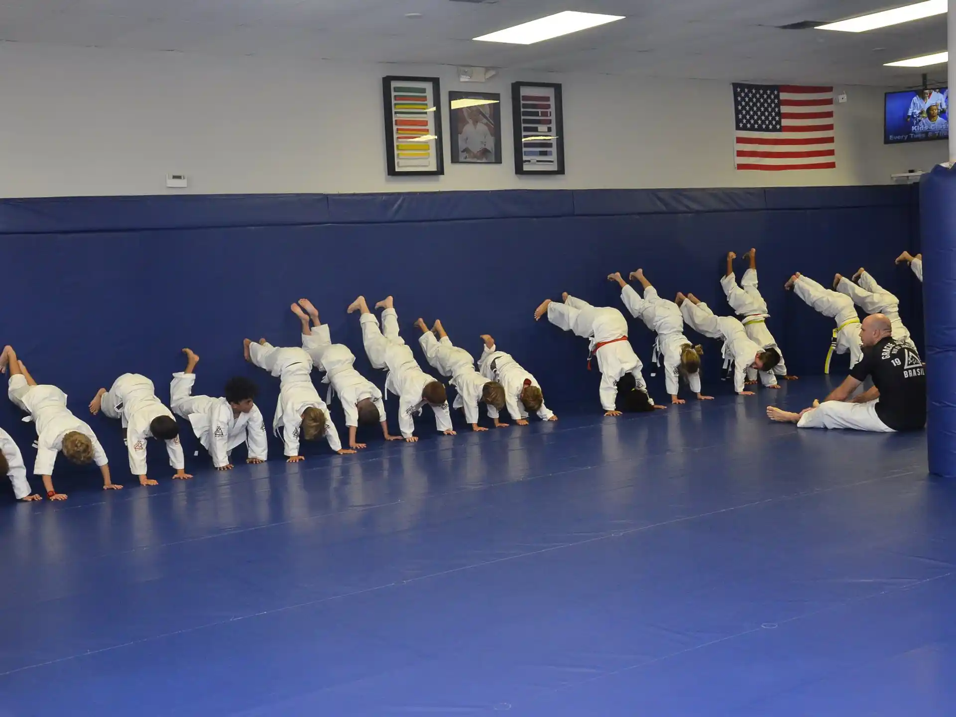 a group of people in karate uniforms